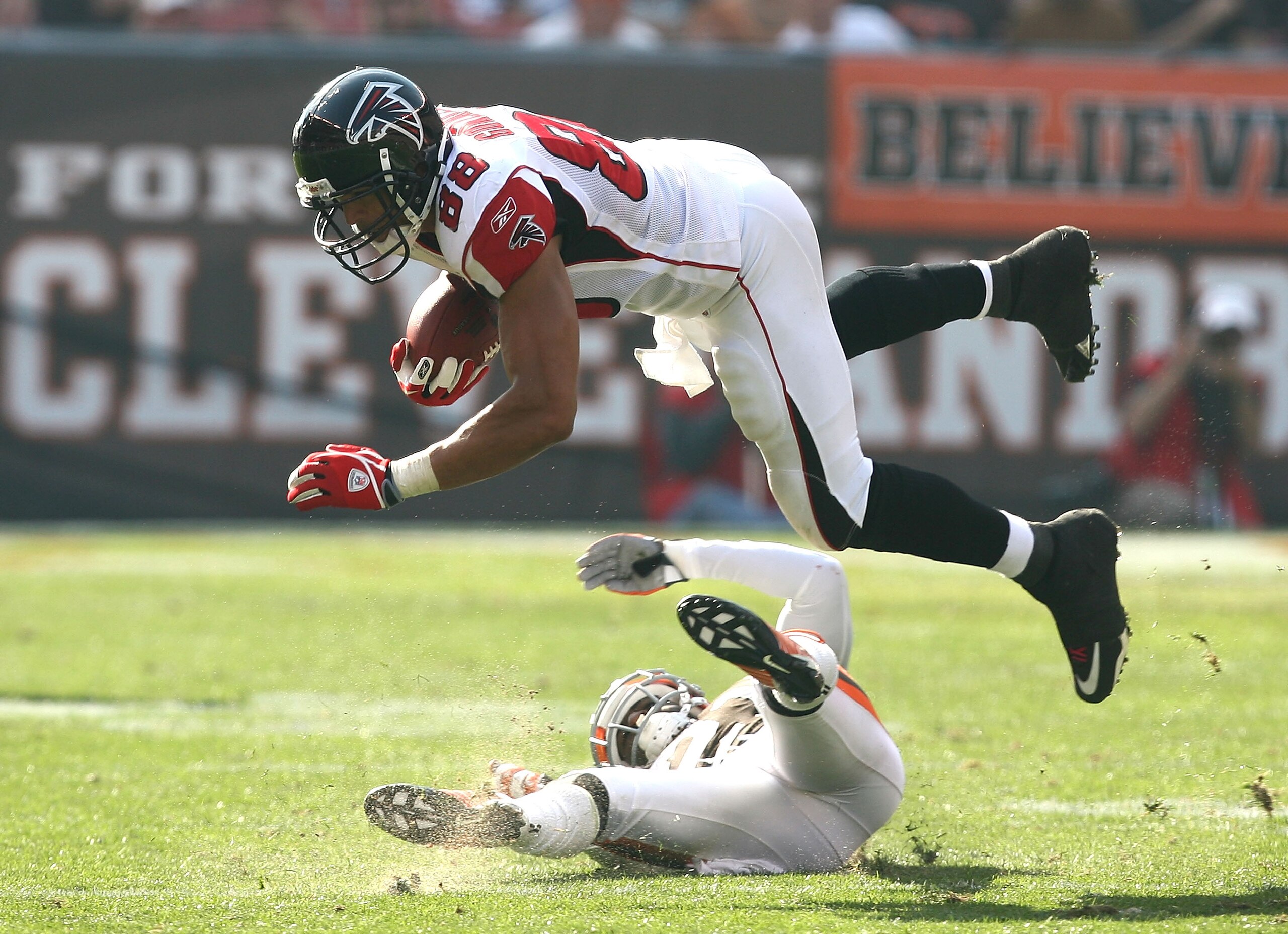 CLEVELAND - OCTOBER 10: Tight end Tony Gonzalez #88 of the Atlanta Falcons dives over defensive back Eric Wright #21 of the Cleveland Browns at Cleveland Browns Stadium on October 10, 2010 in Cleveland, Ohio. (Photo by Matt Sullivan/Getty Images) CLEVELAND - OCTOBER 10: Tight end Tony Gonzalez #88 of the Atlanta Falcons dives over defensive back Eric Wright #21 of the Cleveland Browns at Cleveland Browns Stadium on October 10, 2010 in Cleveland, Ohio. (Photo by Matt Sullivan/Getty Images)