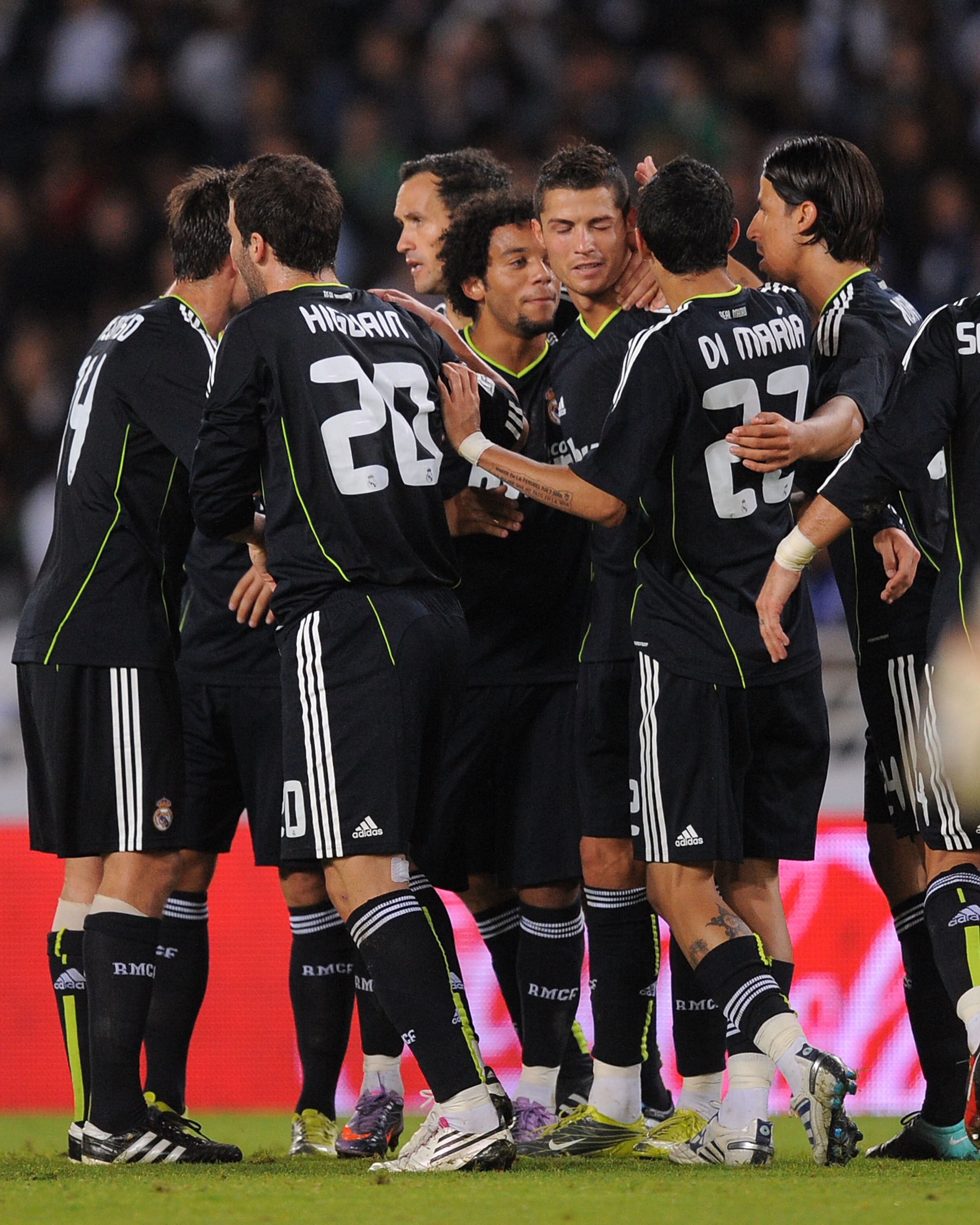 SAN SEBASTIAN, SPAIN - SEPTEMBER 18:  Cristiano Ronaldo (C) of Real Madrid celebrates with teammates after scoring Real's second goal during the La Liga match between Real Sociedad and Real Madrid at Estadio Anoeta on September 18, 2010 in San Sebastian,