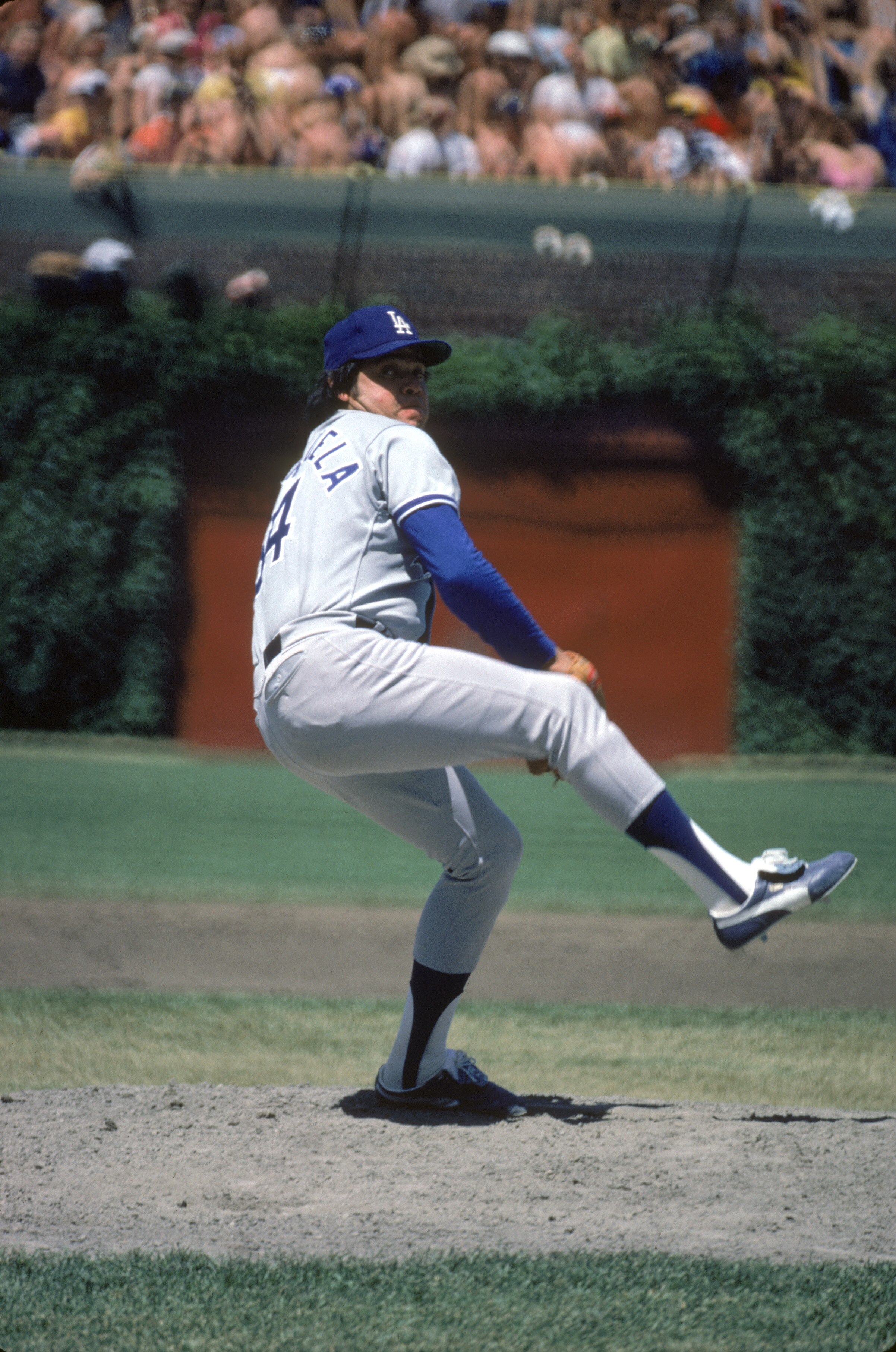CHICAGO, IL - JUNE 6: Pitcher Fernando Valenzuela #34 of the Los Angeles Dodgers winds up for a pitch against the Chicago Cubs on June 6, 1981 at Wrigley Field in Chicago, Illinois. (Photo by: Jonathan Daniel/Getty Images)
