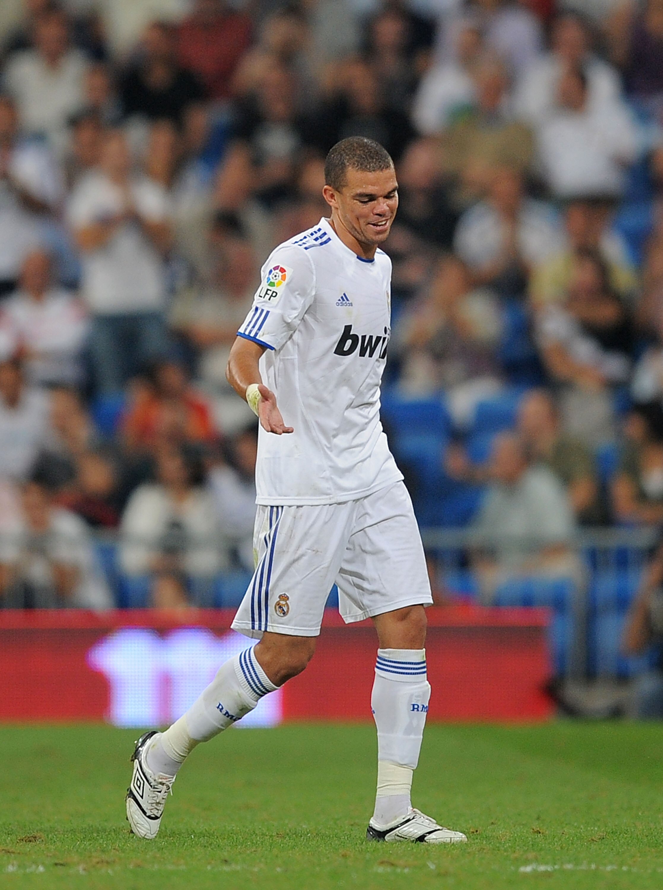 MADRID, SPAIN - SEPTEMBER 21:  Pepe of Real Madrid leaves the field after being shown the red card by refere Clos Gomez during the La Liga match between Real Madrid and Espanyol at Estadio Santiago Bernabeu on September 21, 2010 in Madrid, Spain.  (Photo