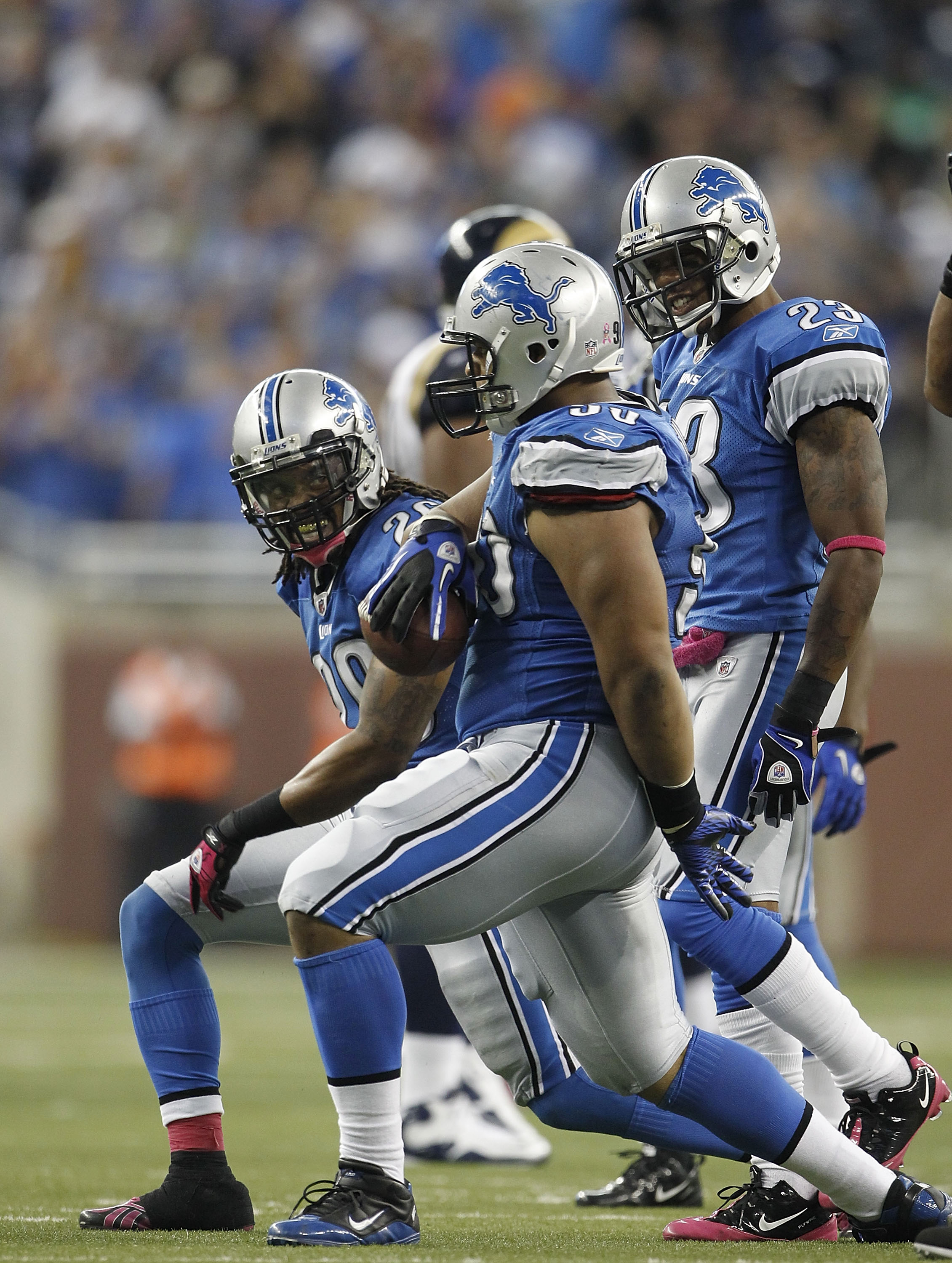 DETROIT - OCTOBER 10: Louis Delmas #26 and Ndamukong Suh #90 of the Detroit Lions celebrate Suh's fourth quarter interception during the game against the St. Louis Rams at Ford Field on October 10, 2010 in Detroit, Michigan.  The Lions defeated the Rams 4