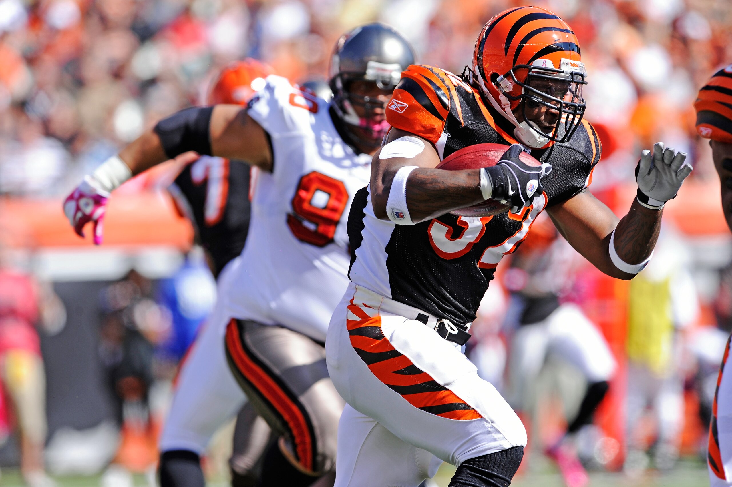 CINCINNATI, OH - OCTOBER 10:  Cedric Benson #32 of the Cincinnati Bengals picks up some of his 144 yards of rushing against the Tampa Bay Buccaneers at Paul Brown Stadium on October 10, 2010 in Cincinnati, Ohio.  (Photo by Jamie Sabau/Getty Images)