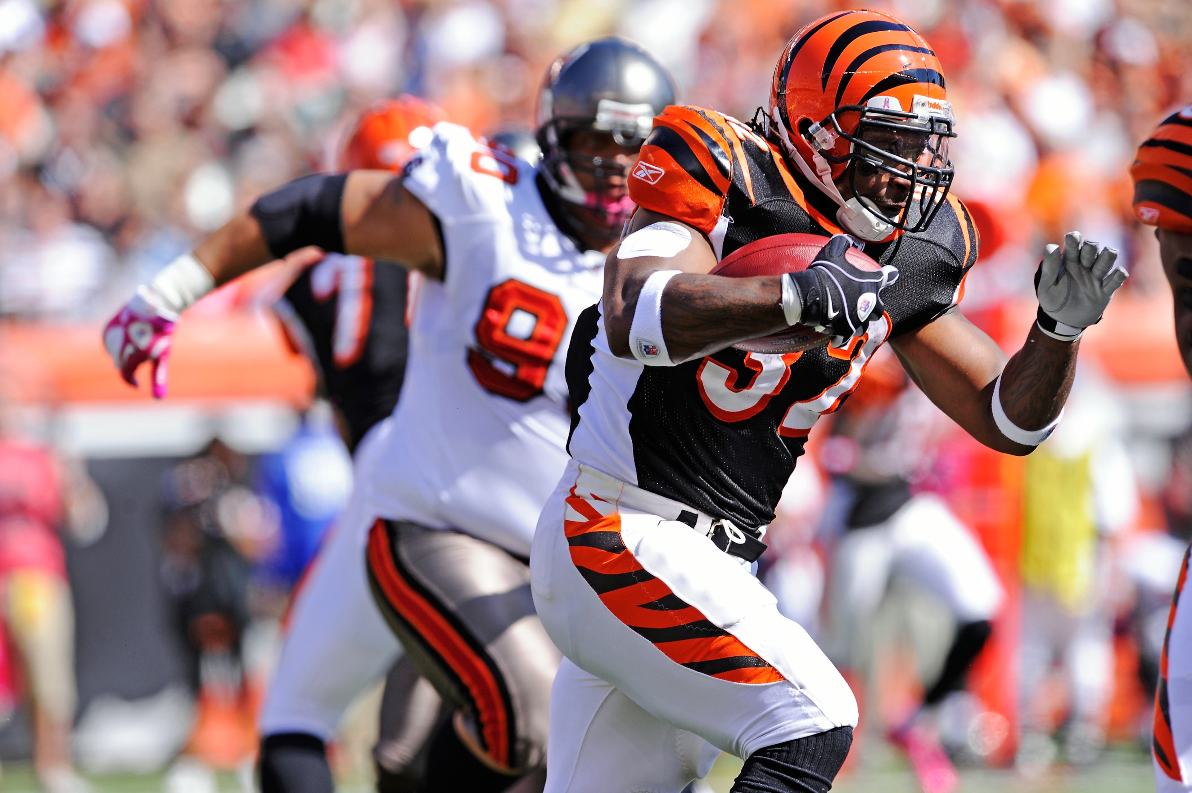 CINCINNATI, OH - OCTOBER 10:  Cedric Benson #32 of the Cincinnati Bengals picks up some of his 144 yards of rushing against the Tampa Bay Buccaneers at Paul Brown Stadium on October 10, 2010 in Cincinnati, Ohio.  (Photo by Jamie Sabau/Getty Images)