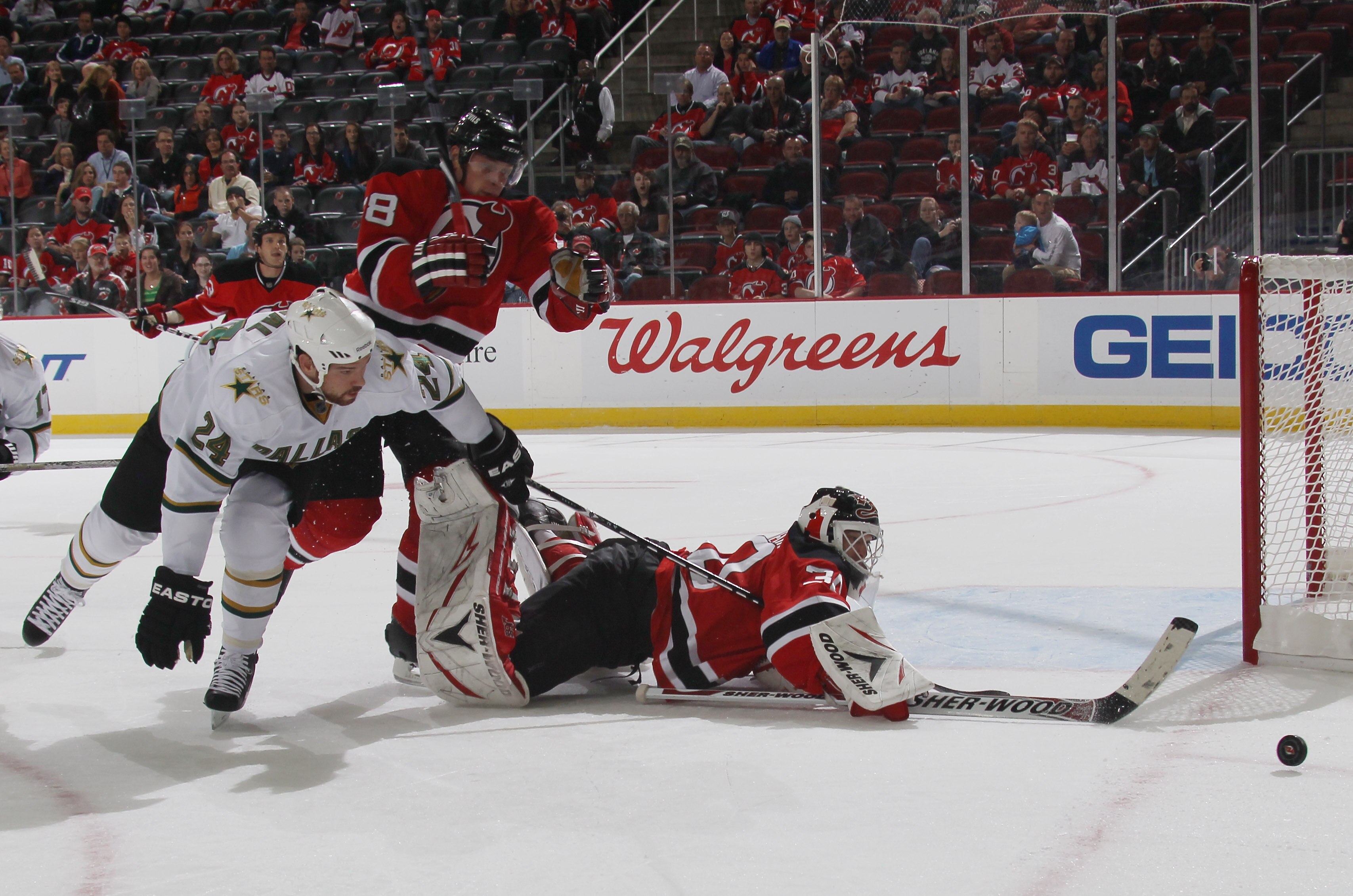 NEWARK, NJ - OCTOBER 08: Martin Brodeur #30 of the New Jersey Devils swats the puck away from Brandon Segal #24 of the Dallas Stars at the Prudential Center on October 8, 2010 in Newark, New Jersey.  (Photo by Bruce Bennett/Getty Images)