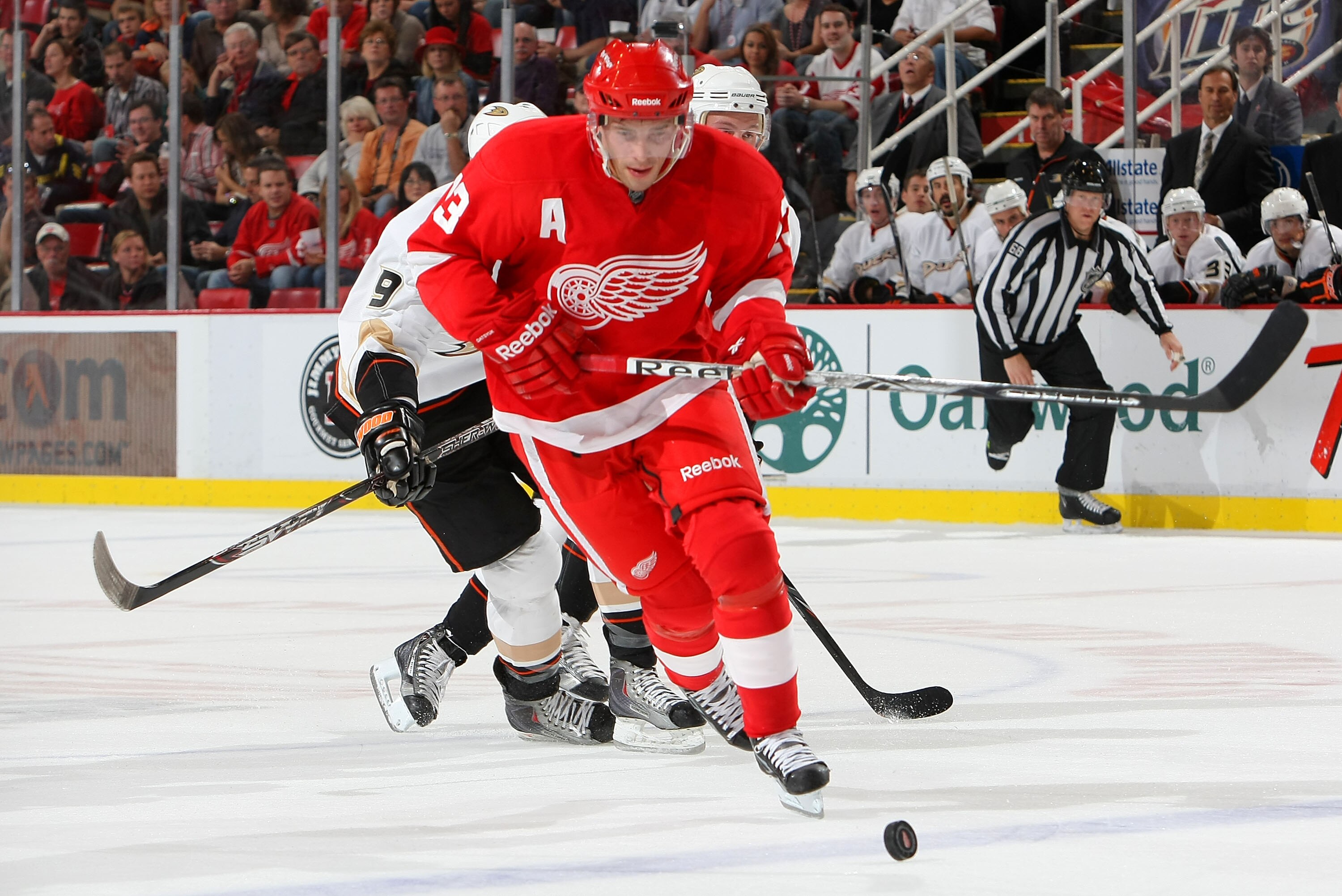 DETROIT - OCTOBER 8:  Pavel Datsyuk #13 of the Detroit Red Wings skates after a loose puck against the Anaheim Ducks at Joe Louis Arena on October 8, 2010 in Detroit, Michigan.(Photo By Dave Sandford/Getty Images)