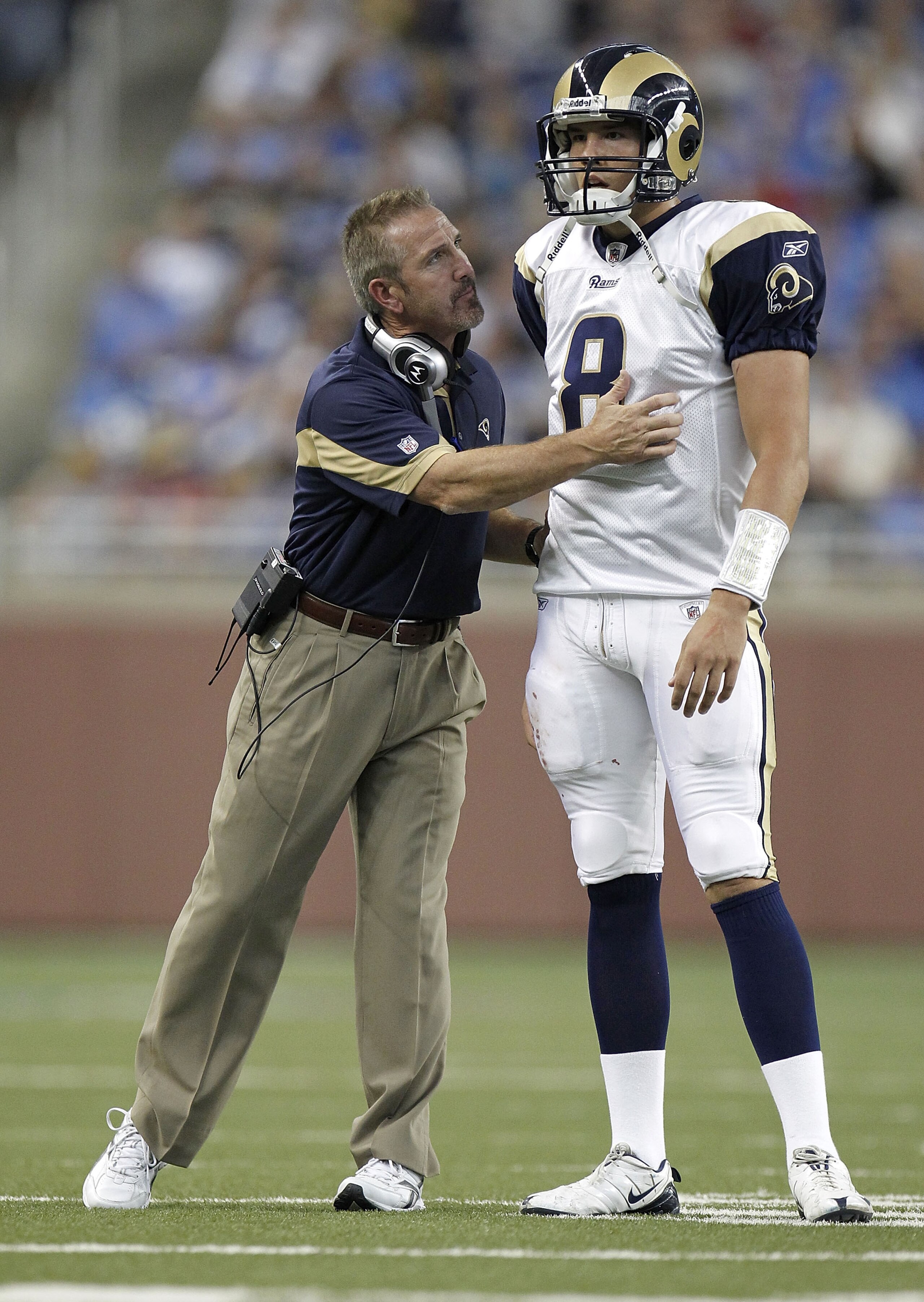 DETROIT - OCTOBER 10: Sam Bradford #8 of the St. Louis Rams talks with head coach Steve Spagnuolo while playing the Detroit Lions on October 10, 2010 at Ford Field in Detroit, Michigan. (Photo by Gregory Shamus/Getty Images) DETROIT - OCTOBER 10: Sam Bradford #8 of the St. Louis Rams talks with head coach Steve Spagnuolo while playing the Detroit Lions on October 10, 2010 at Ford Field in Detroit, Michigan. (Photo by Gregory Shamus/Getty Images)