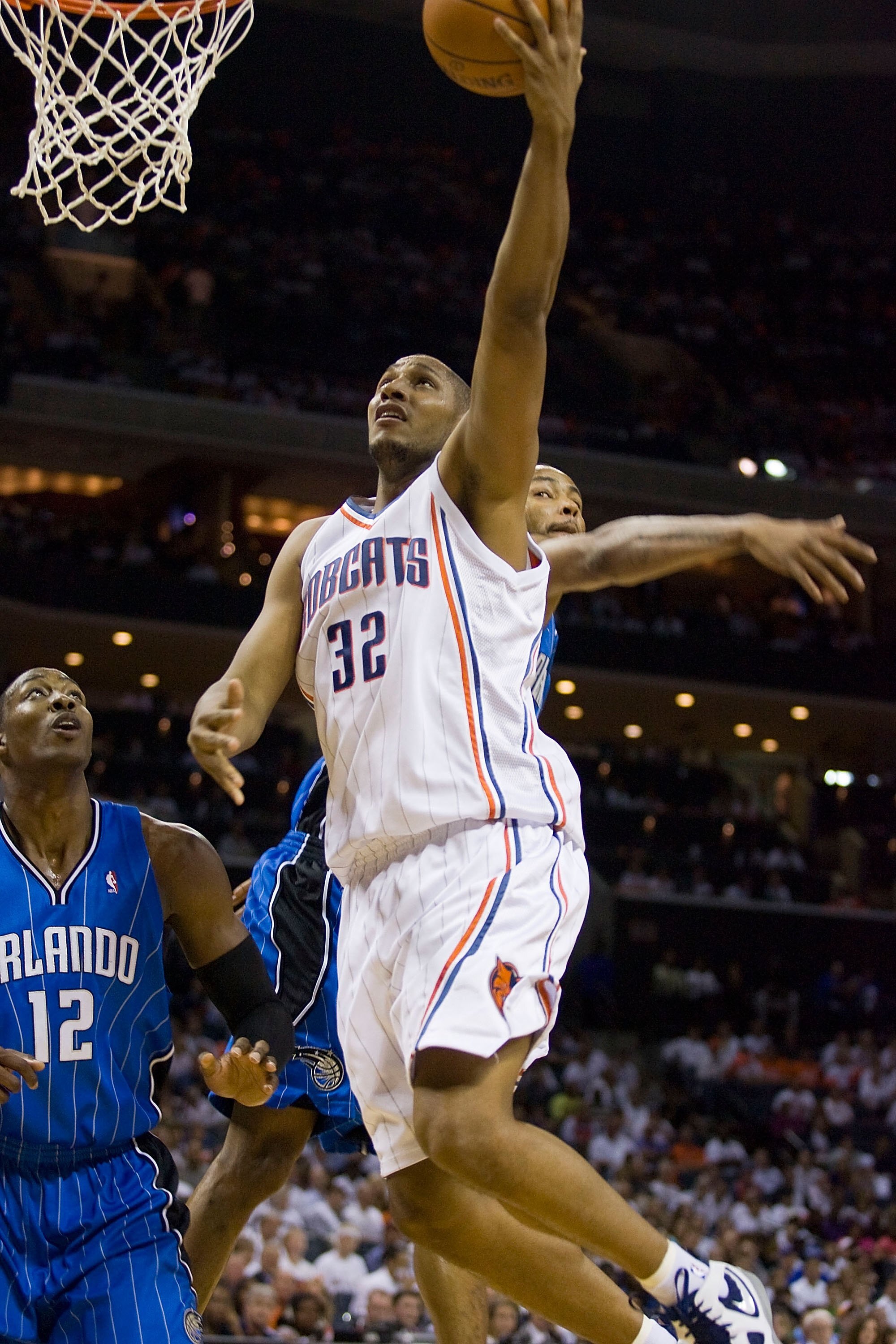 CHARLOTTE, NC - APRIL 26: Boris Diaw #32 of the Charlotte Bobcats drives to the basket past Dwight Howard #12 of the Orlando Magic at Time Warner Cable Arena on April 26, 2010 in Charlotte, North Carolina.  The Magic defeated the Bobcats 99-90 to complete