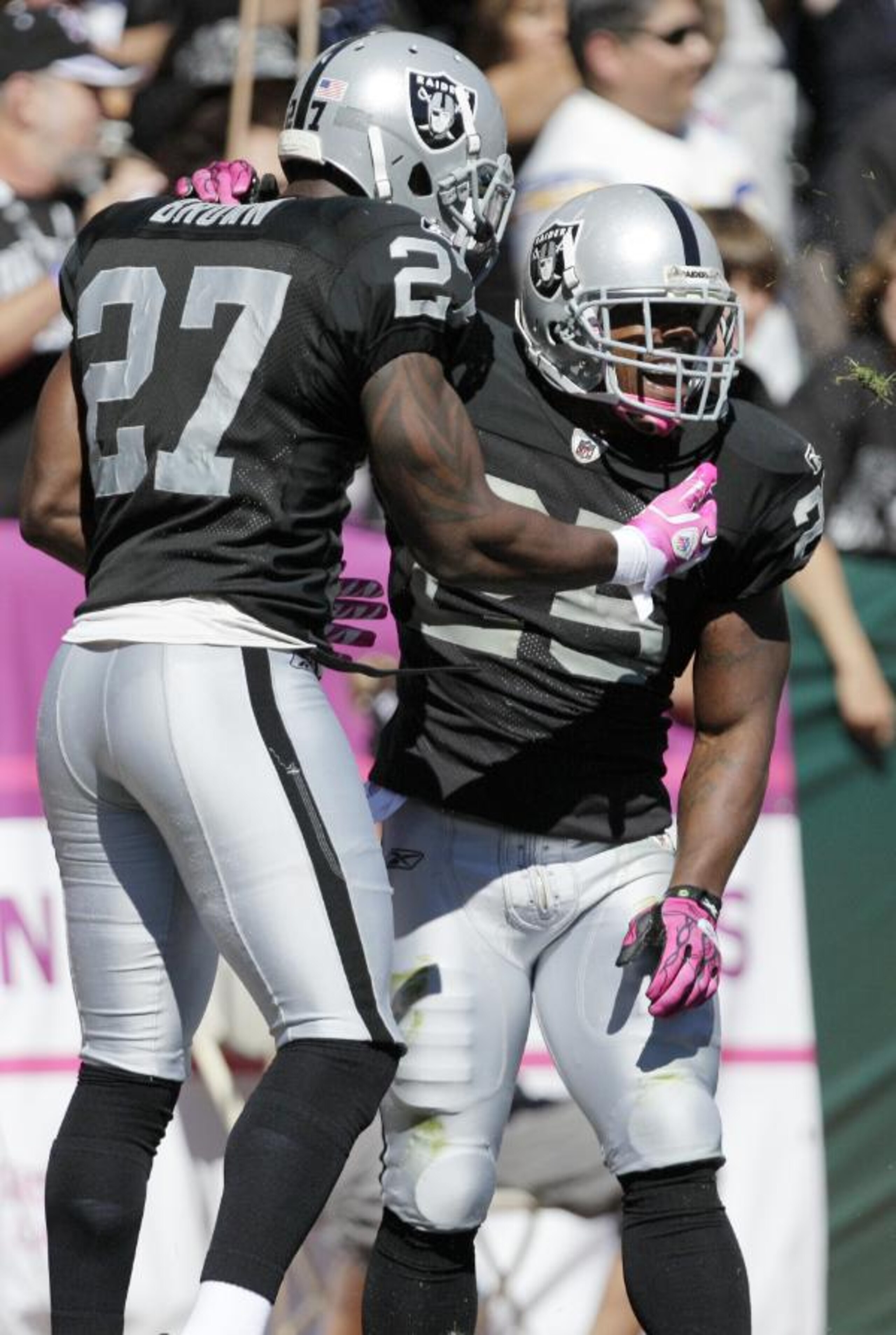Stevie Brown and Rock Cartwright celebrate after Cartwright's blocked punt.