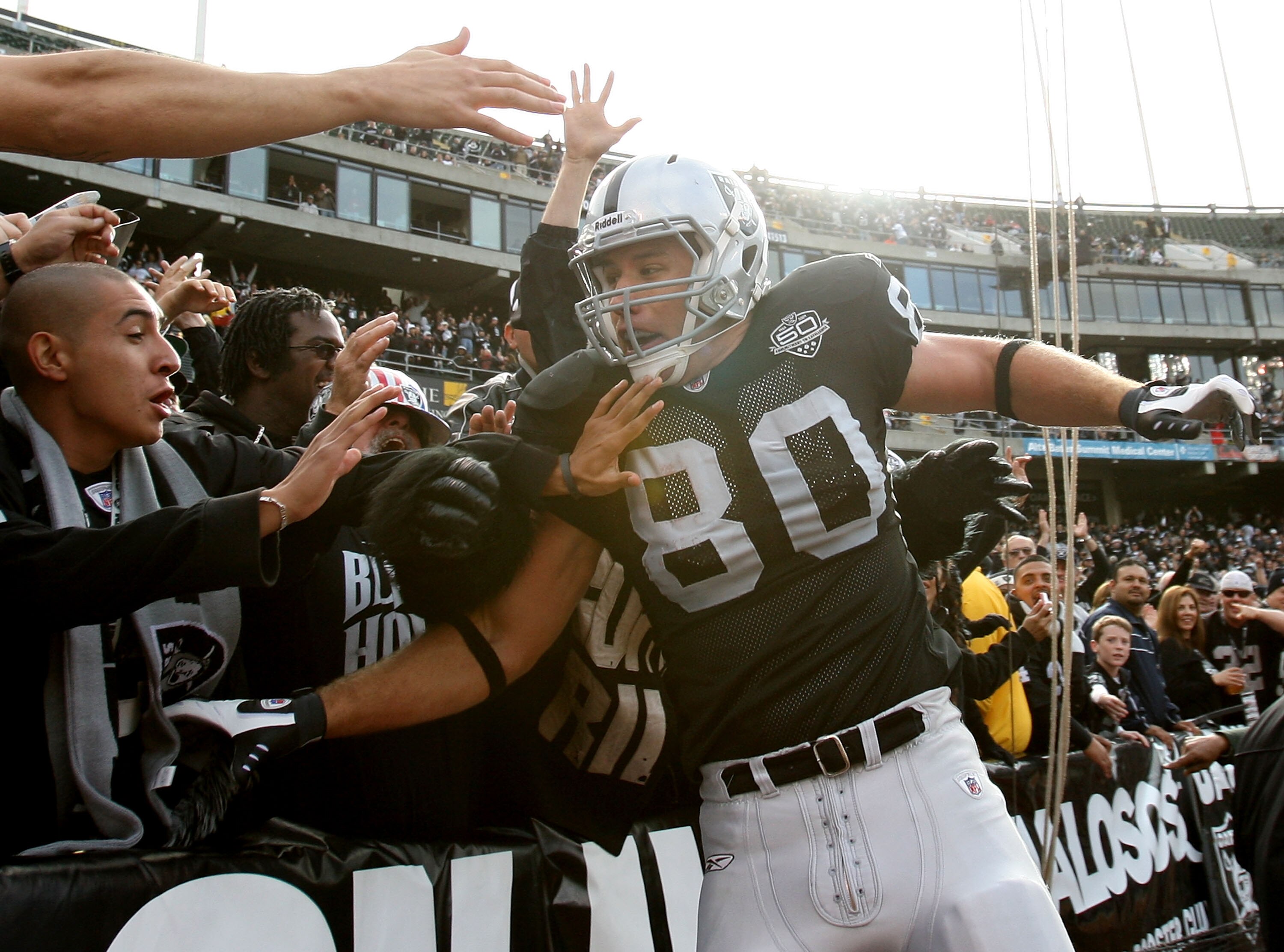 OAKLAND, CA - NOVEMBER 22:  Zach Miller #80 of the Oakland Raiders celebrates after scoring a touchdown in the second quarter against the Cincinnati Bengals during an NFL game at Oakland-Alameda County Coliseum on November 22, 2009 in Oakland, California.