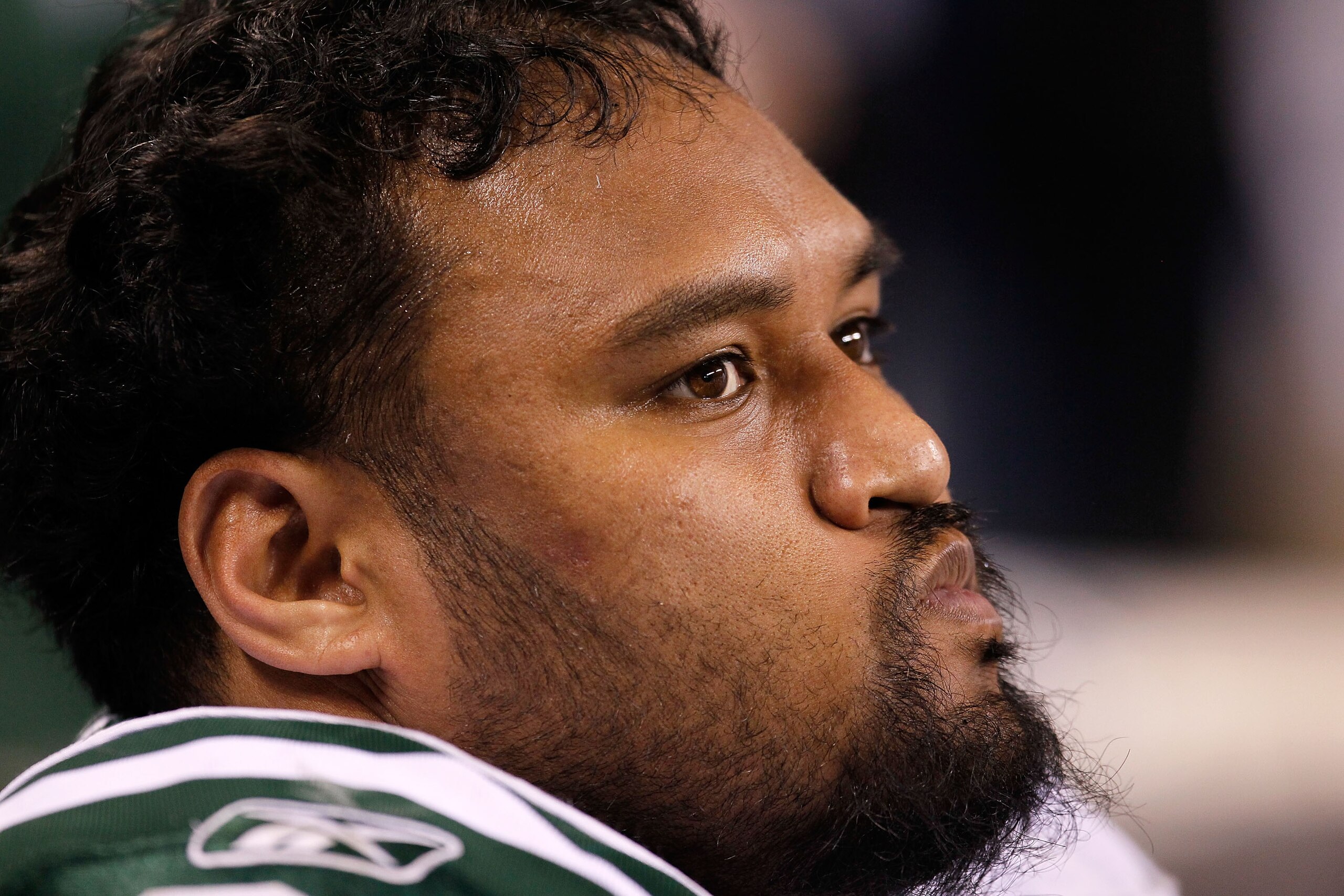 INDIANAPOLIS - JANUARY 24:  Sione Pouha #91 of the New York Jets looks on from the sidelines during the fourth quarter of the game against the Indianapolis Colts during the AFC Championship Game at Lucas Oil Stadium on January 24, 2010 in Indianapolis, In