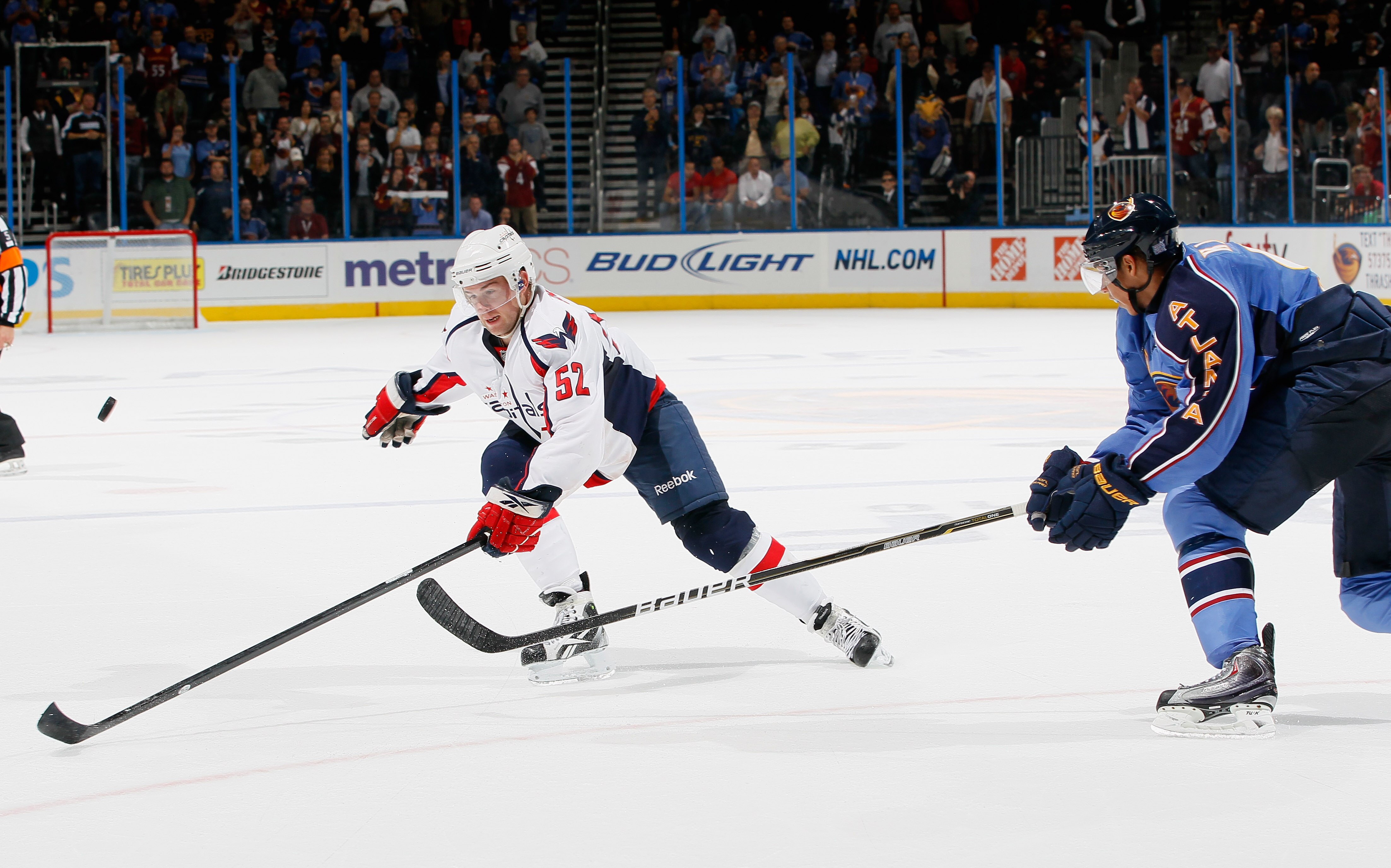 ATLANTA - OCTOBER 08:  Evander Kane #9 of the Atlanta Thrashers breaks up a pass to Mike Green #52 of the Washington Capitals at Philips Arena on October 8, 2010 in Atlanta, Georgia.  (Photo by Kevin C. Cox/Getty Images)