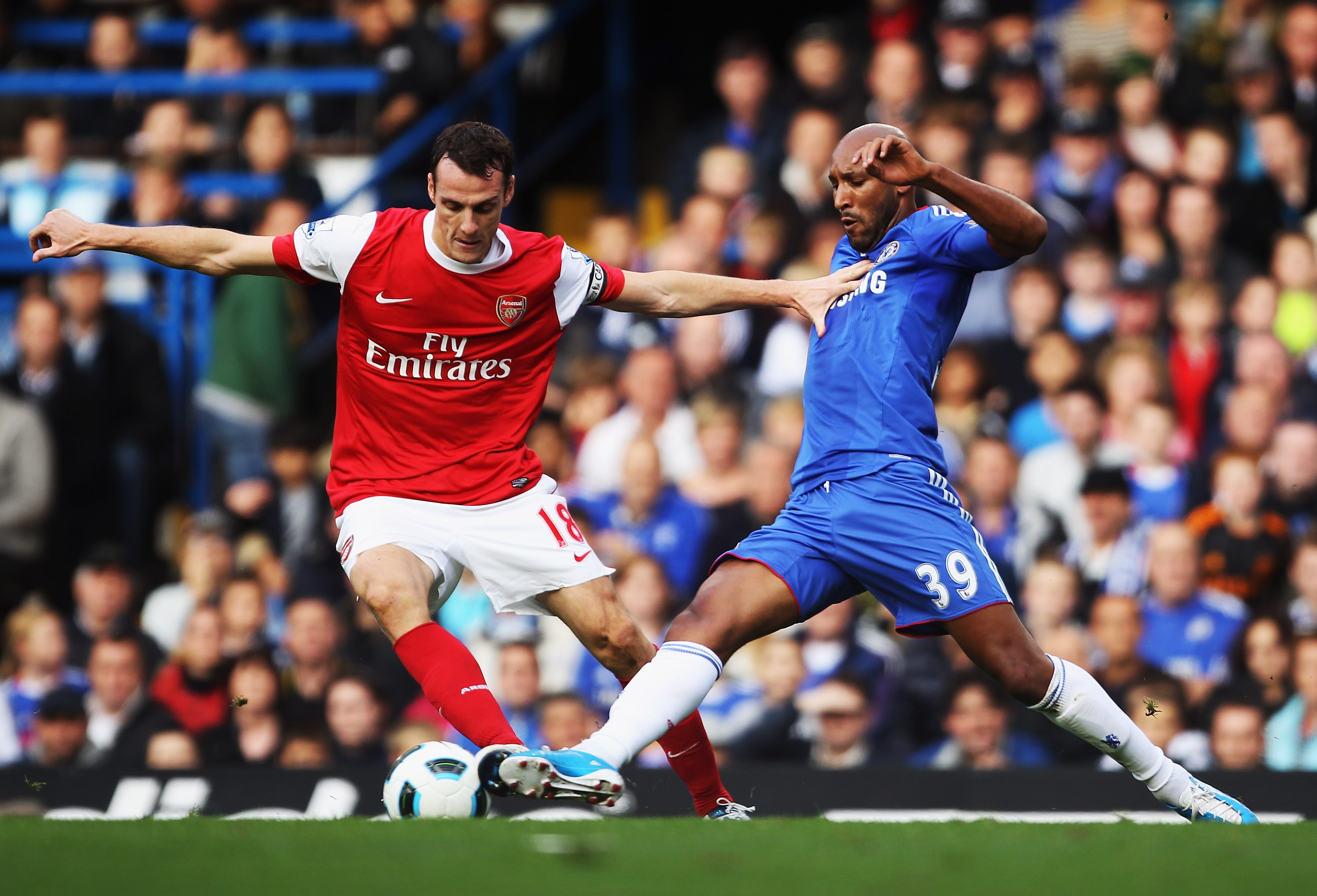 LONDON, ENGLAND - OCTOBER 03:  Nicolas Anelka of Chelsea tackles Sebastien Squillaci of Arsenal during the Barclays Premier League match between Chelsea and Arsenal at Stamford Bridge on October 3, 2010 in London, England.  (Photo by Bryn Lennon/Getty Ima
