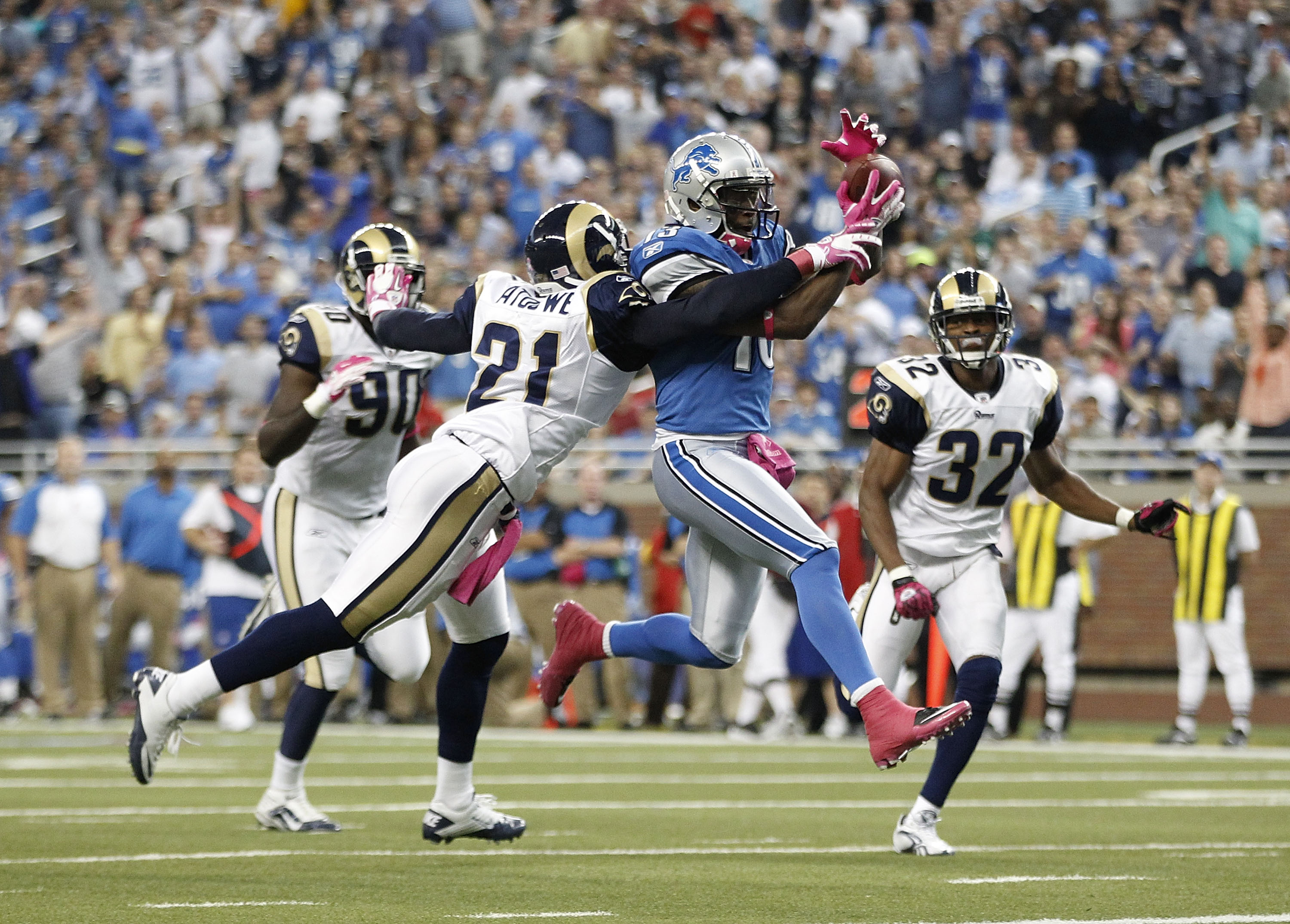 DETROIT - OCTOBER 10: Nate Burleson #13 of the Detroit Lions scores a third quarter touchdown on a 21 yard pass from Shaun Hill #14 during the third quarter of the game against the St. Louis Rams during the second quarter of the game at Ford Field on Octo