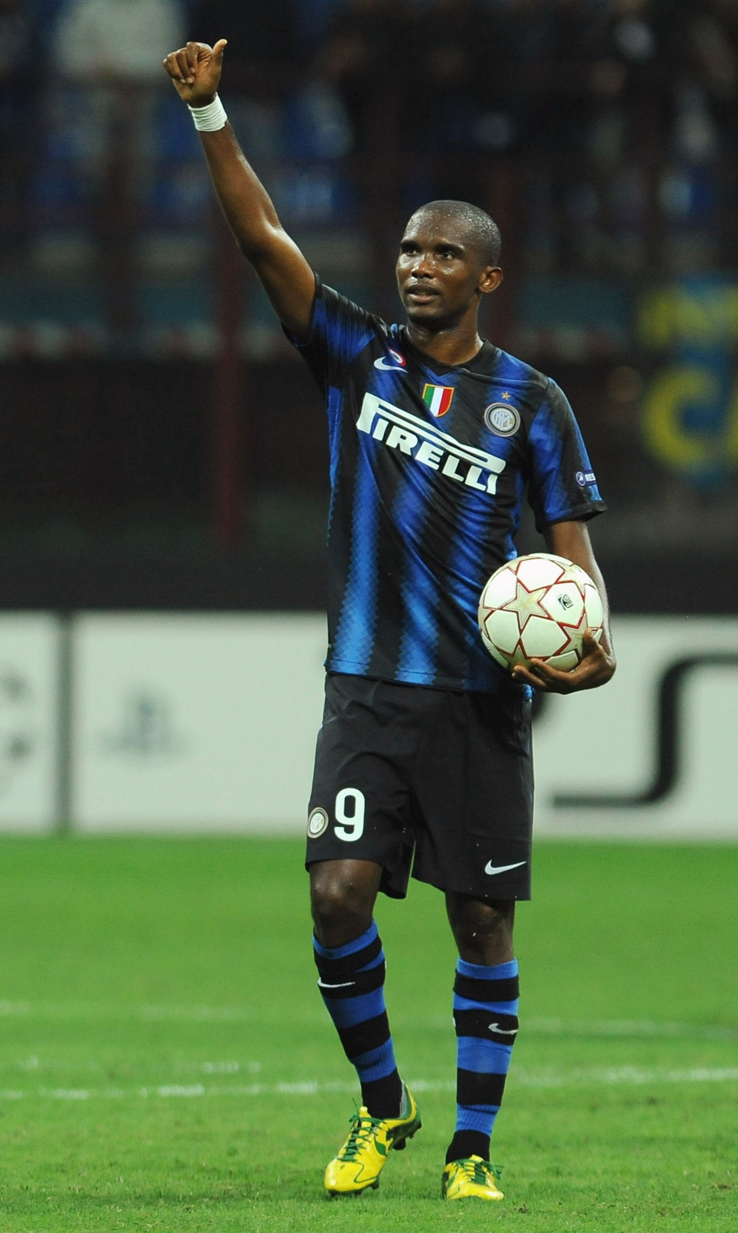 MILAN, ITALY - SEPTEMBER 29:  Samuel Eto'o of FC Internazionale Milano with the ball of the match celebrates victoryafter the UEFA Champions League group A match between FC Internazionale Milano and SV Werder Bremen at Stadio Giuseppe Meazza on September 