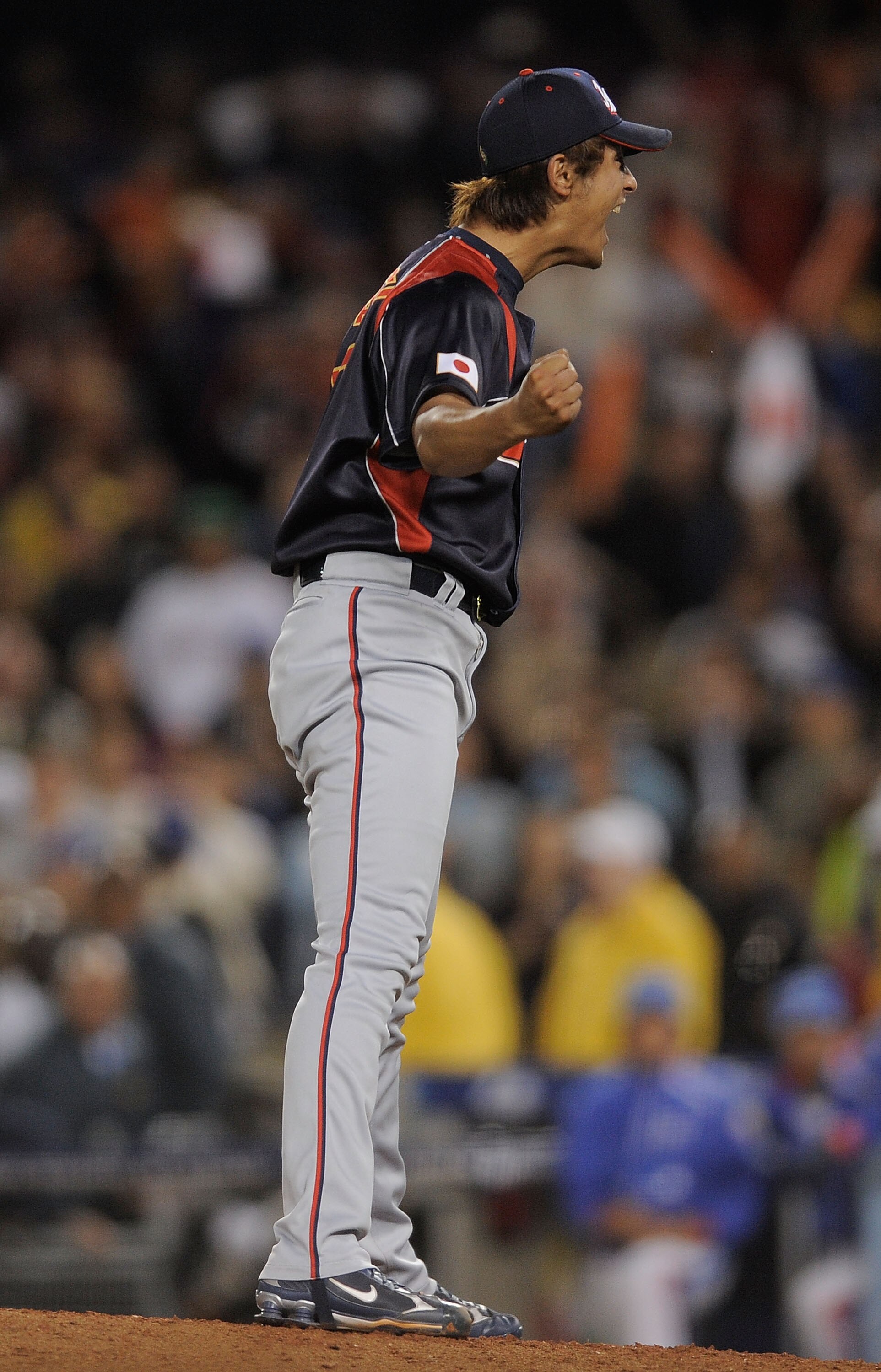 LOS ANGELES, CA - MARCH 23:  Pitcher Yu Darvish #11 of Japan celebrates after defeating Korea 5-3 in the finals of the 2009 World Baseball Classic on March 23, 2009 at Dodger Stadium in Los Angeles, California.  (Photo by Kevork Djansezian/Getty Images)