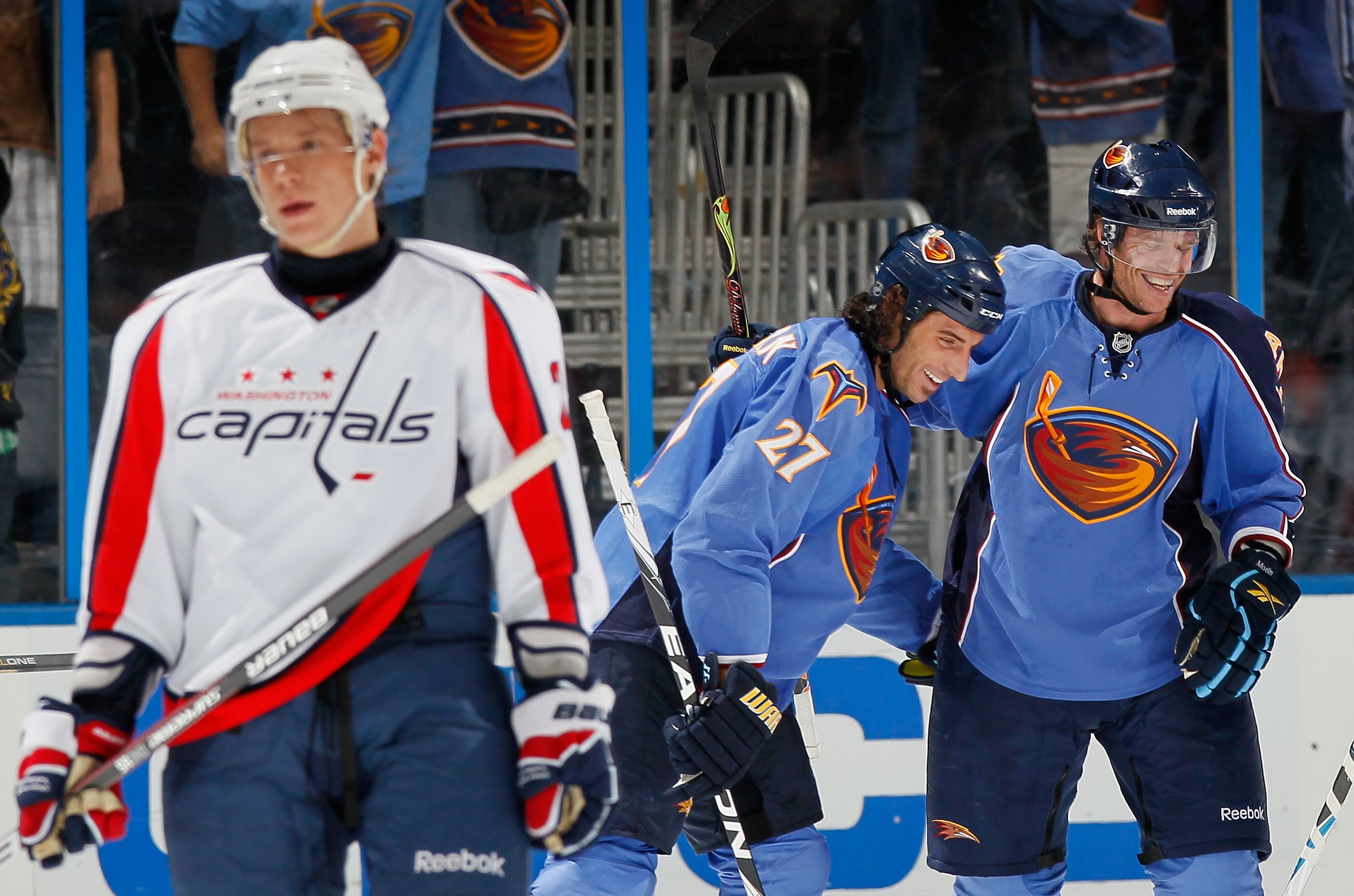 ATLANTA - OCTOBER 08:  Alexander Semin #28 of the Washington Capitals skates away as Fredrik Modin #19 and Chris Thorburn #27 of the Atlanta Thrashers celebrate Modin's goal at Philips Arena on October 8, 2010 in Atlanta, Georgia.  (Photo by Kevin C. Cox/