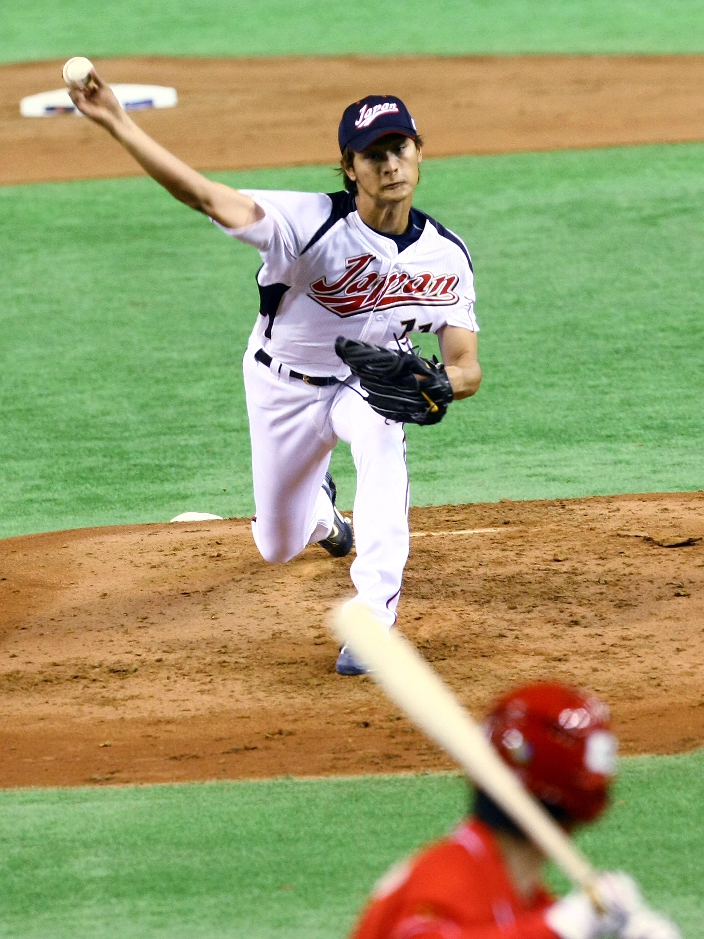 TOKYO - MARCH 05:  Starting Pitcher Yu Darvish #11 of Japan throws a pitch during the World Baseball Classic Tokyo Round match between Japan and China at Tokyo Dome on March 5, 2009 in Tokyo, Japan.  (Photo by Junko Kimura/Getty Images)