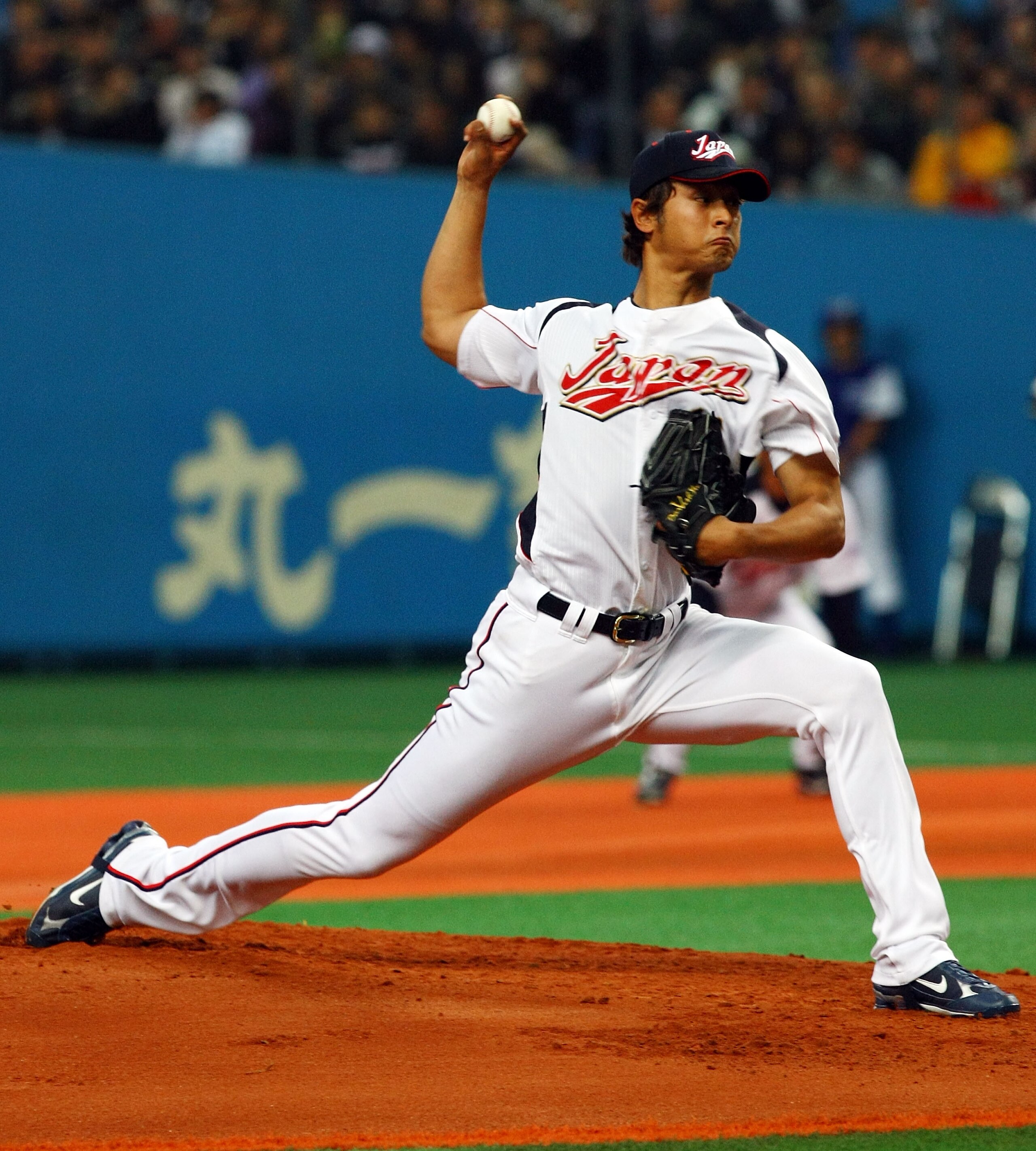 OSAKA, JAPAN - FEBRUARY 24:  Starting Pictcher Yu Darvish #11 of Japan pitches during an exhibition match between Japan and Australia at Kyocera Dome Osaka on February 24, 2009 in Osaka, Japan.  (Photo by Junko Kimura/Getty Images)