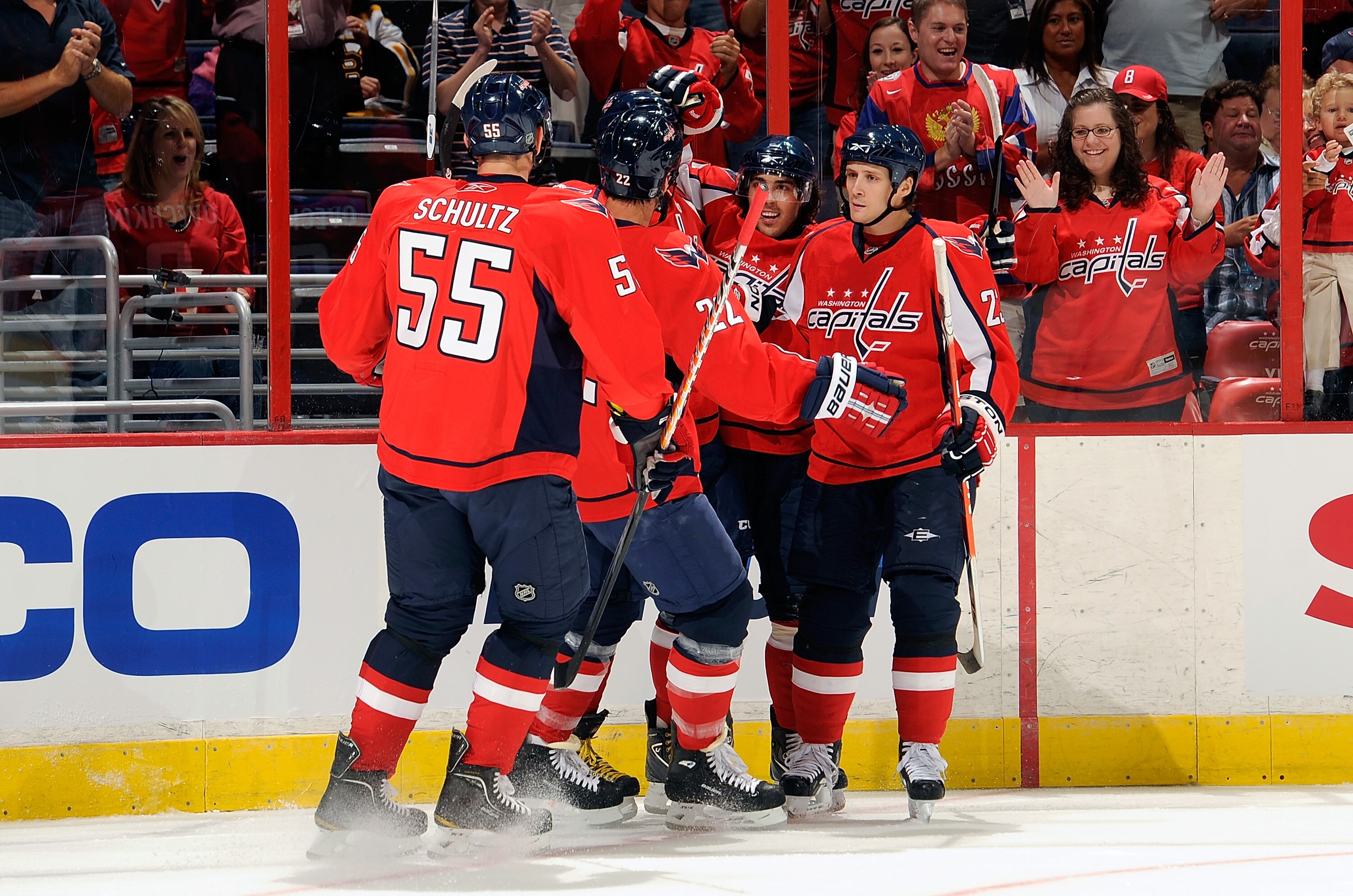 WASHINGTON - SEPTEMBER 28:  Mathieu Perreault #85 of the Washington Capitals celebrates with teammates after scoring in the first period against the Boston Bruins at Verizon Center on September 28, 2010 in Washington, DC.  (Photo by Greg Fiume/Getty Image