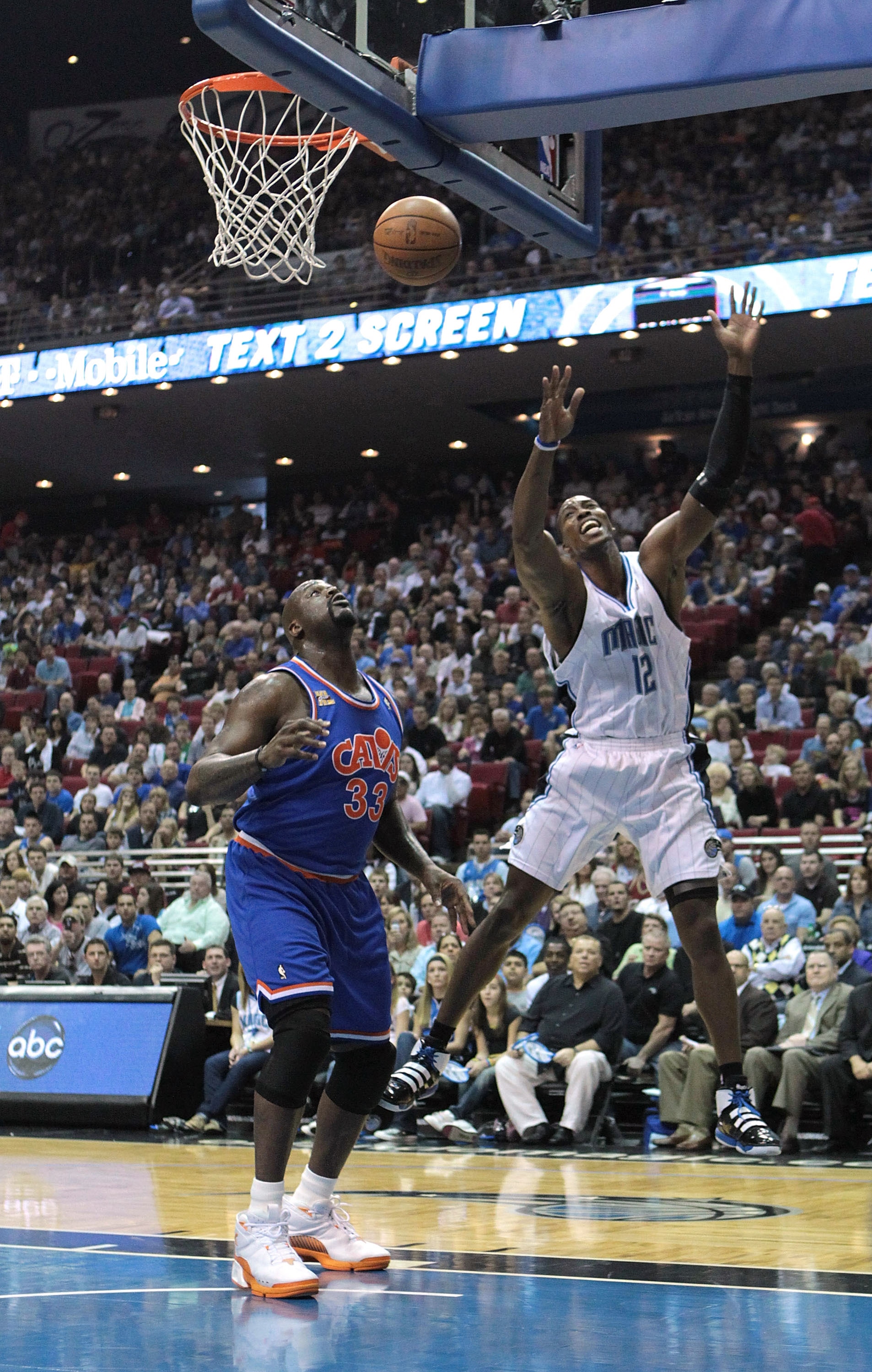 ORLANDO, FL - FEBRUARY 21: Dwight Howard #12 of the Orlando Magic attempts a shot over Shaquille O'Neal #33 of the Cleveland Cavaliers at Amway Arena on February 21, 2010 in Orlando, Florida. NOTE TO USER: User expressly acknowledges and agrees that, by ORLANDO, FL - FEBRUARY 21: Dwight Howard #12 of the Orlando Magic attempts a shot over Shaquille O'Neal #33 of the Cleveland Cavaliers at Amway Arena on February 21, 2010 in Orlando, Florida. NOTE TO USER: User expressly acknowledges and agrees that, by