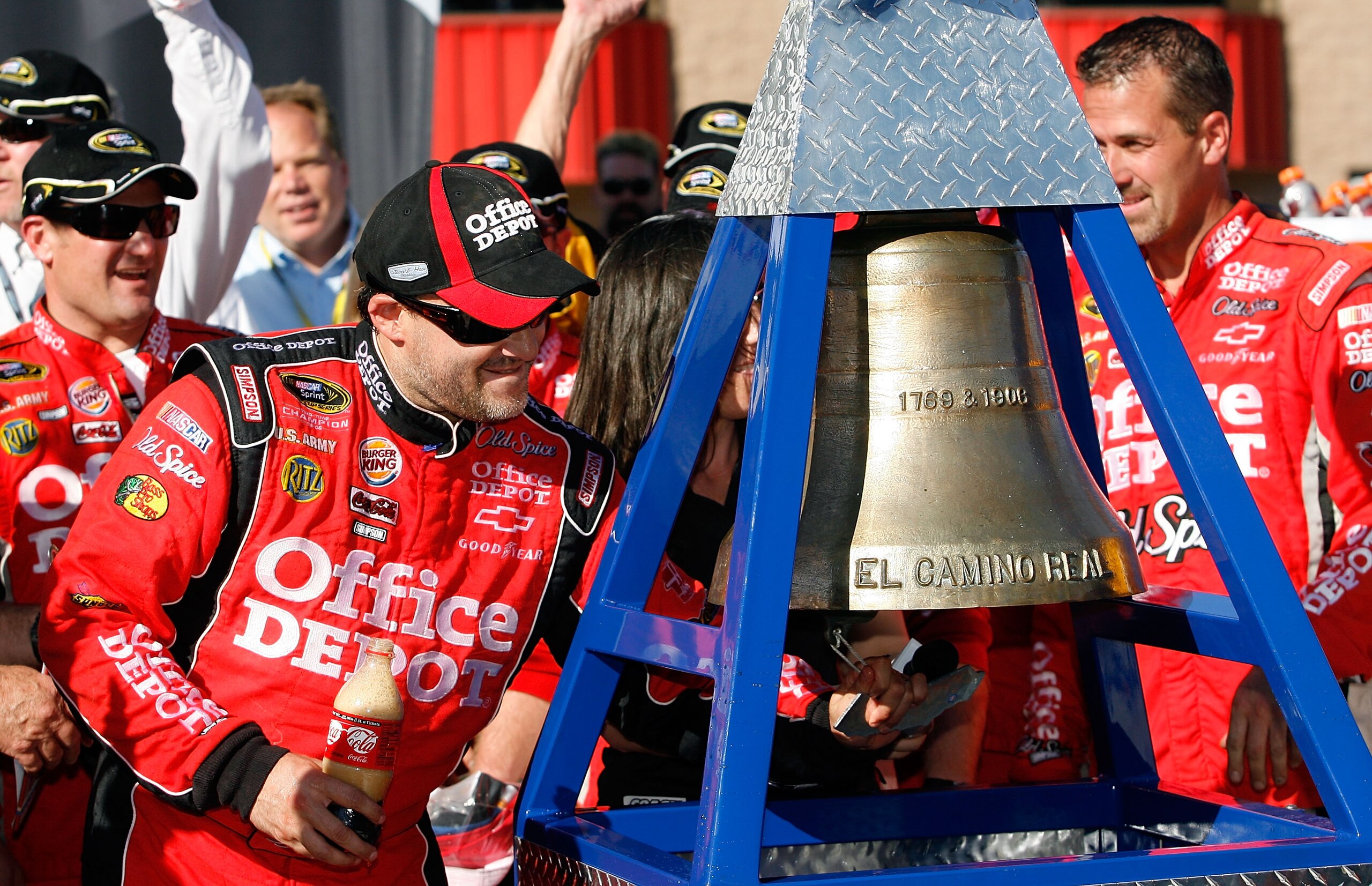 FONTANA, CA - OCTOBER 10: Tony Stewart (L), driver of the #14 Office Depot Chevrolet, celebrates in victory lane after winning the NASCAR Sprint Cup Series Pepsi Max 400 on October 10, 2010 in Fontana, California. (Photo by Tom Pennington/Getty Images f FONTANA, CA - OCTOBER 10: Tony Stewart (L), driver of the #14 Office Depot Chevrolet, celebrates in victory lane after winning the NASCAR Sprint Cup Series Pepsi Max 400 on October 10, 2010 in Fontana, California. (Photo by Tom Pennington/Getty Images f