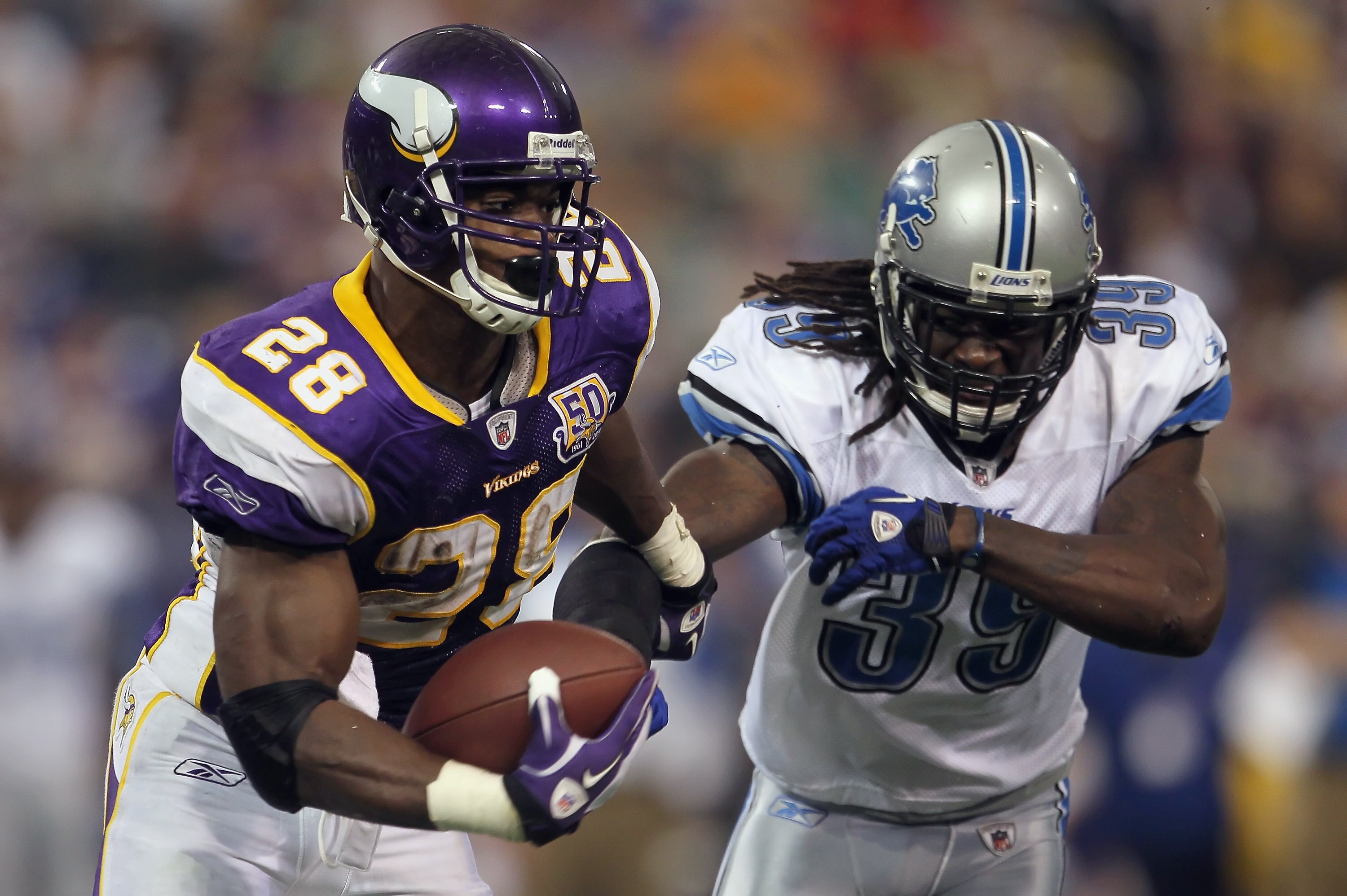 MINNEAPOLIS - SEPTEMBER 26:  Running back Adrian Peterson #28 of the Minnesota Vikings carries the ball around C.C. Brown #39 of the Detroit Lions for a touchdown during the second half at Mall of America Field on September 26, 2010 in Minneapolis, Minnes