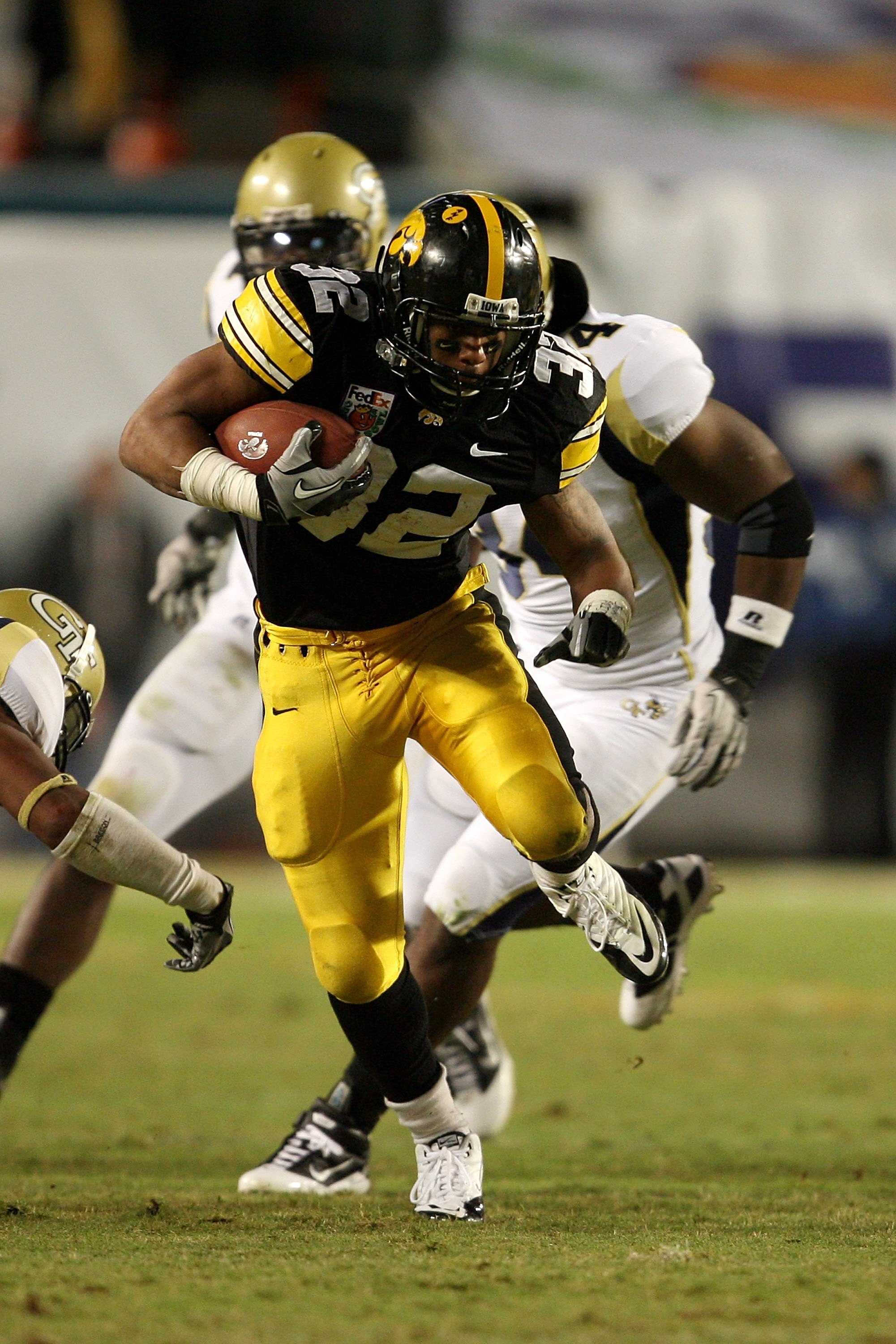 MIAMI GARDENS, FL - JANUARY 05:  Running back Adam Robinson #32 of the Iowa Hawkeyes runs the ball against the Georgia Tech Yellow Jackets during the FedEx Orange Bowl at Land Shark Stadium on January 5, 2010 in Miami Gardens, Florida. Iowa won 24-14. (Ph