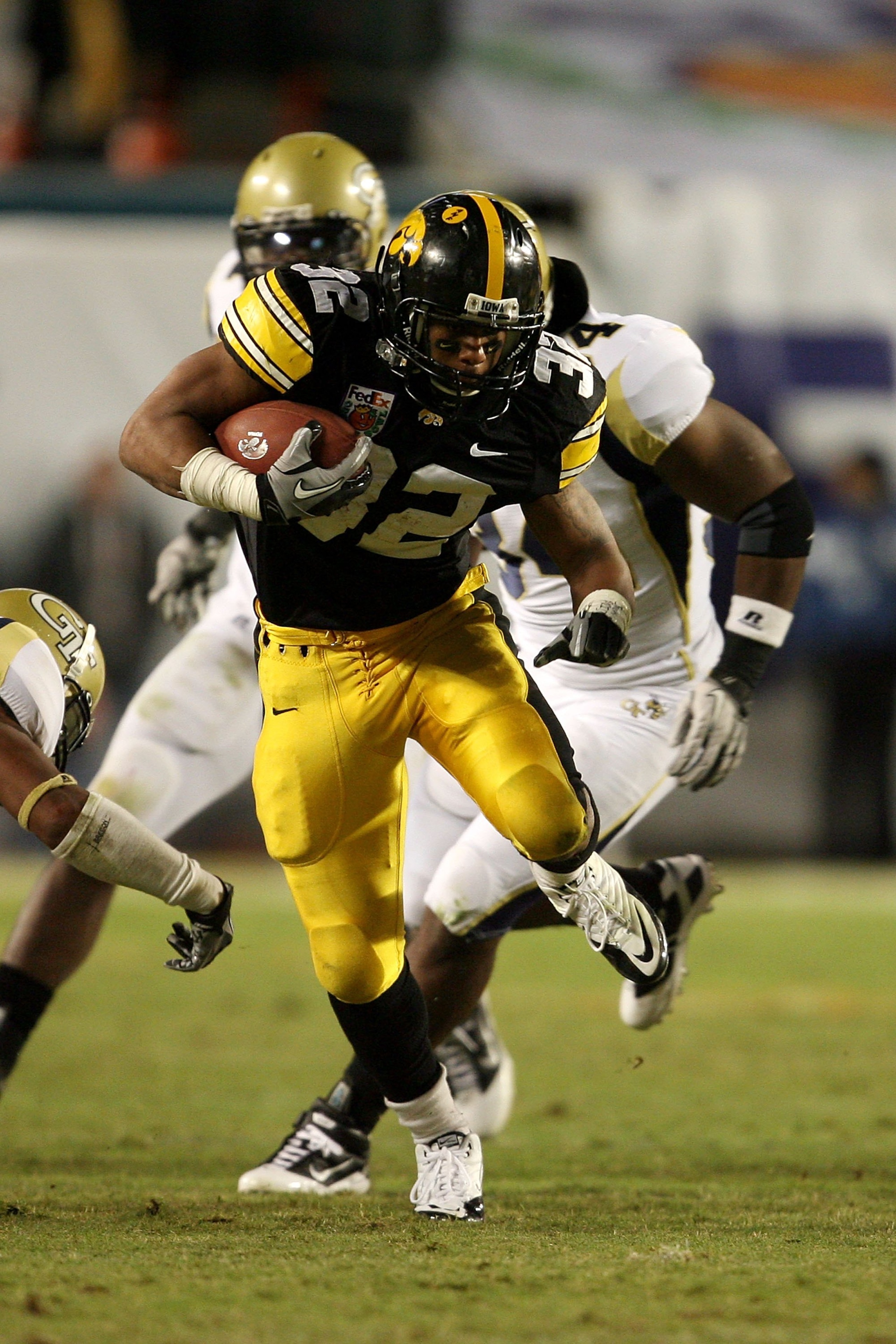 MIAMI GARDENS, FL - JANUARY 05:  Running back Adam Robinson #32 of the Iowa Hawkeyes runs the ball against the Georgia Tech Yellow Jackets during the FedEx Orange Bowl at Land Shark Stadium on January 5, 2010 in Miami Gardens, Florida. Iowa won 24-14. (Ph
