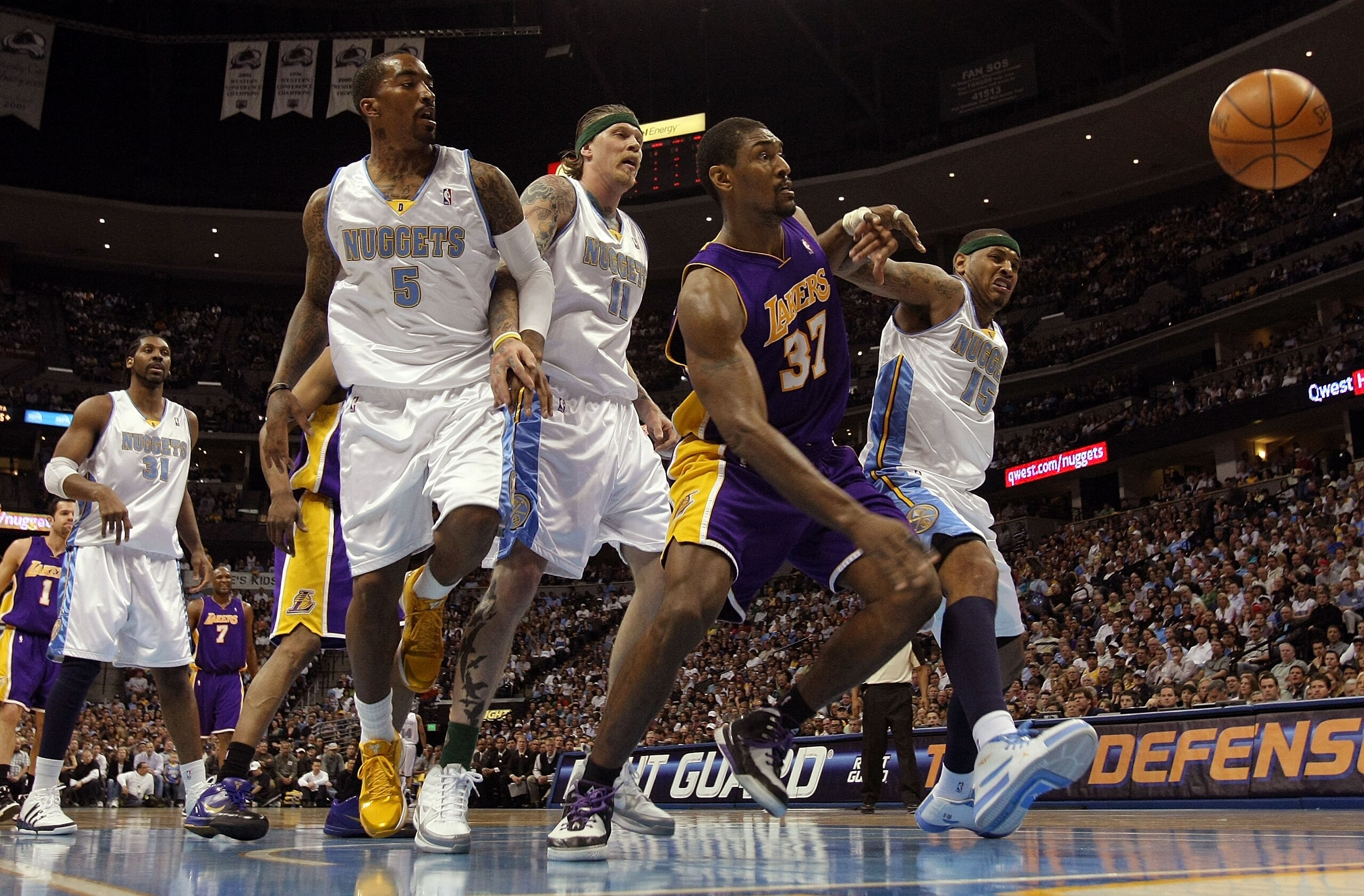 DENVER - APRIL 08:  Ron Artest #37 of the Los Angeles Lakers and Carmelo Anthony #15 of the Denver Nuggets battle for a loose ball as J.R. Smith #5 and Chris Andersen #11 of the Nuggets follow the action during NBA action at the Pepsi Center on April 8, 2