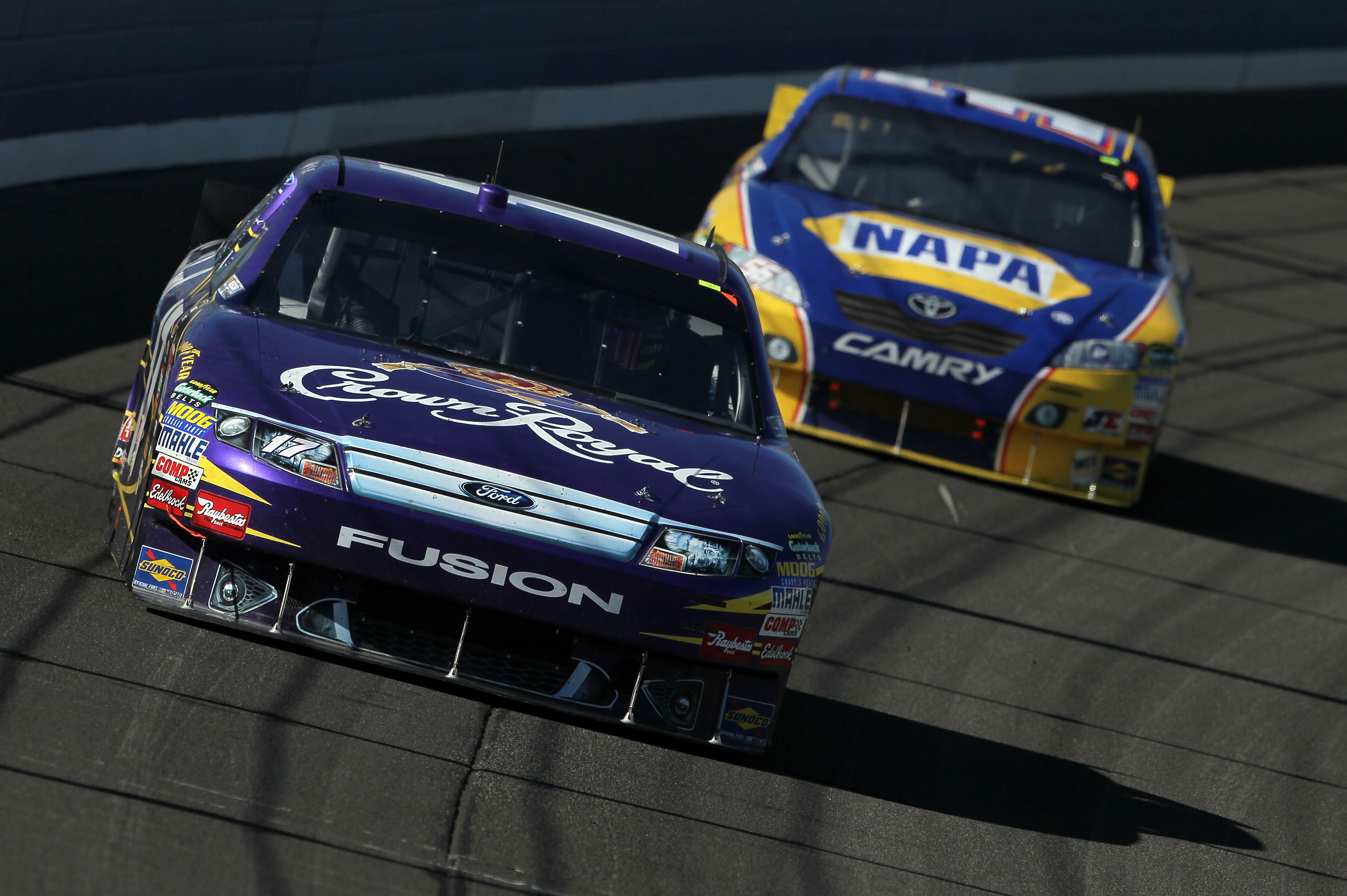 FONTANA, CA - OCTOBER 10:  Matt Kenseth, driver of the #17 Crown Royal Ford, leads Martin Truex Jr., driver of the #56 NAPA Toyota, during the NASCAR Sprint Cup Series Pepsi Max 400 on October 10, 2010 in Fontana, California.  (Photo by Jeff Gross/Getty I