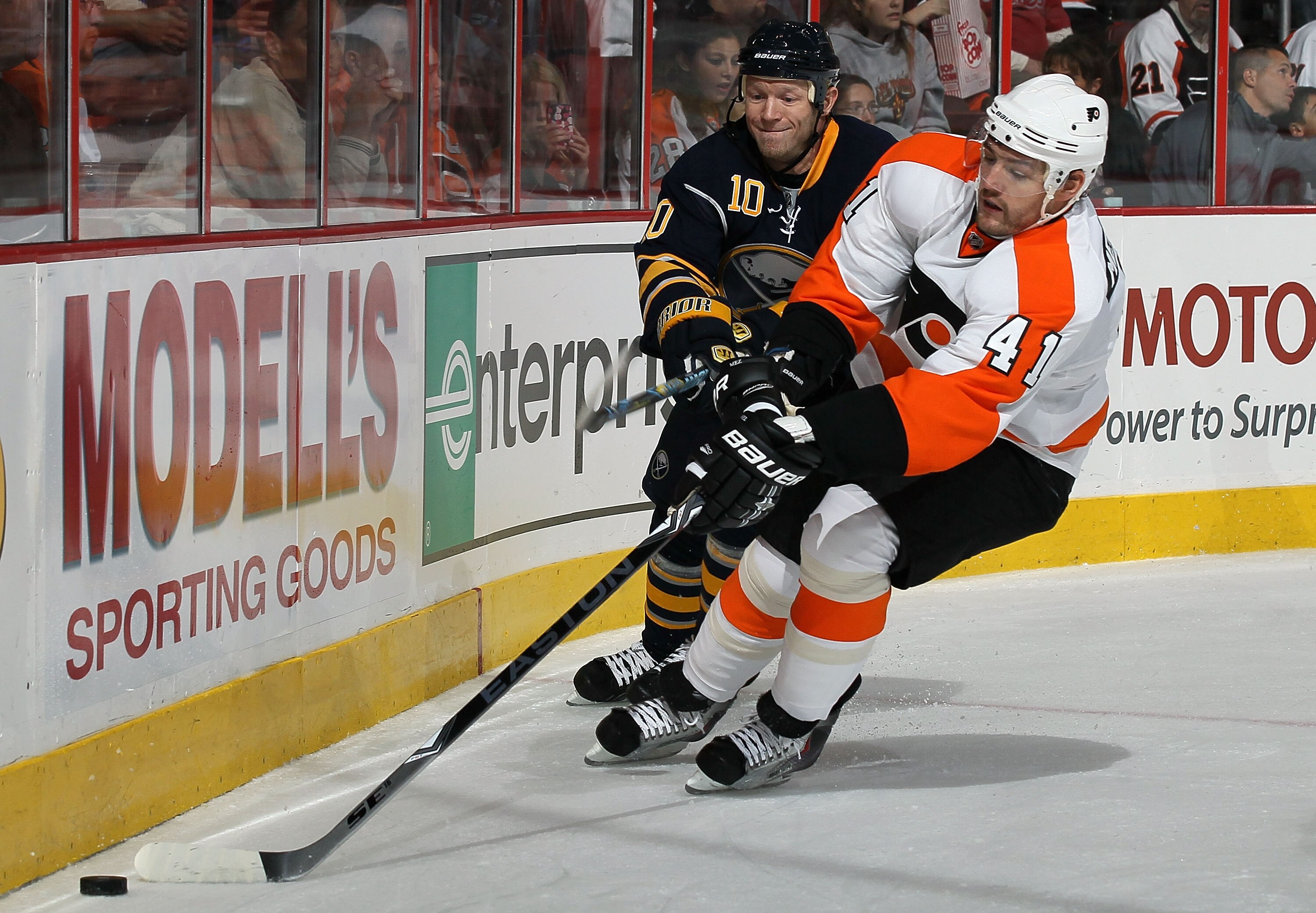 PHILADELPHIA - OCTOBER 01:  Andrej Meszaros #41 of the Philadelphia Flyers plays the puck against Mark Parrish #10 of the Buffalo Sabres on October 1, 2010 at Wells Fargo Center in Philadelphia, Pennsylvania.  (Photo by Jim McIsaac/Getty Images)