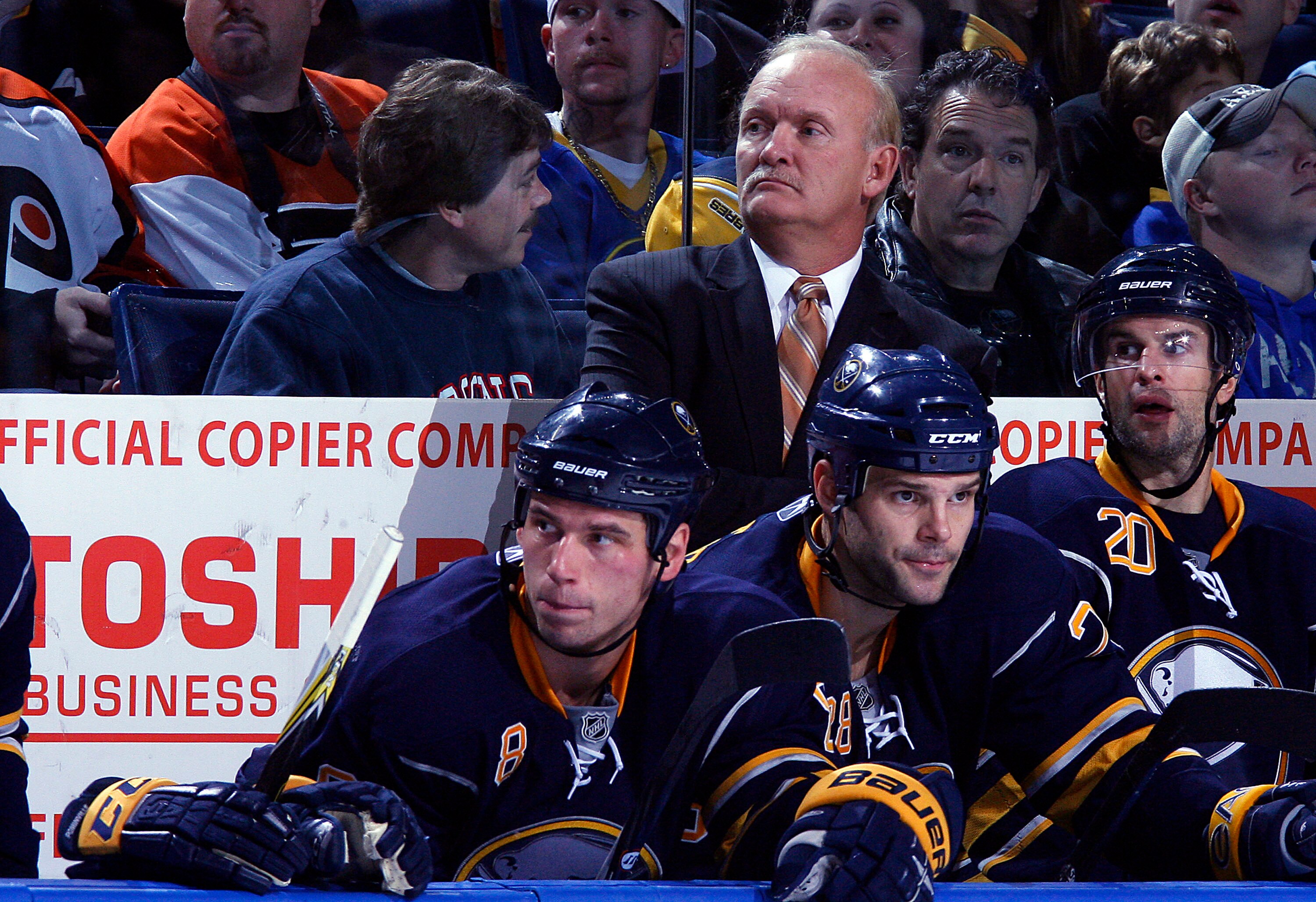 BUFFALO - OCTOBER 3:  Head Coach Lindy Ruff  looks on as Cody McCormick #8, Paul Gaustad #28 and Rob Niedermayer #20 all of the Buffalo Sabres sit on the bench as play goes on  against the Philadelphia Flyers during their NHL game at HSBC Arena October 3,