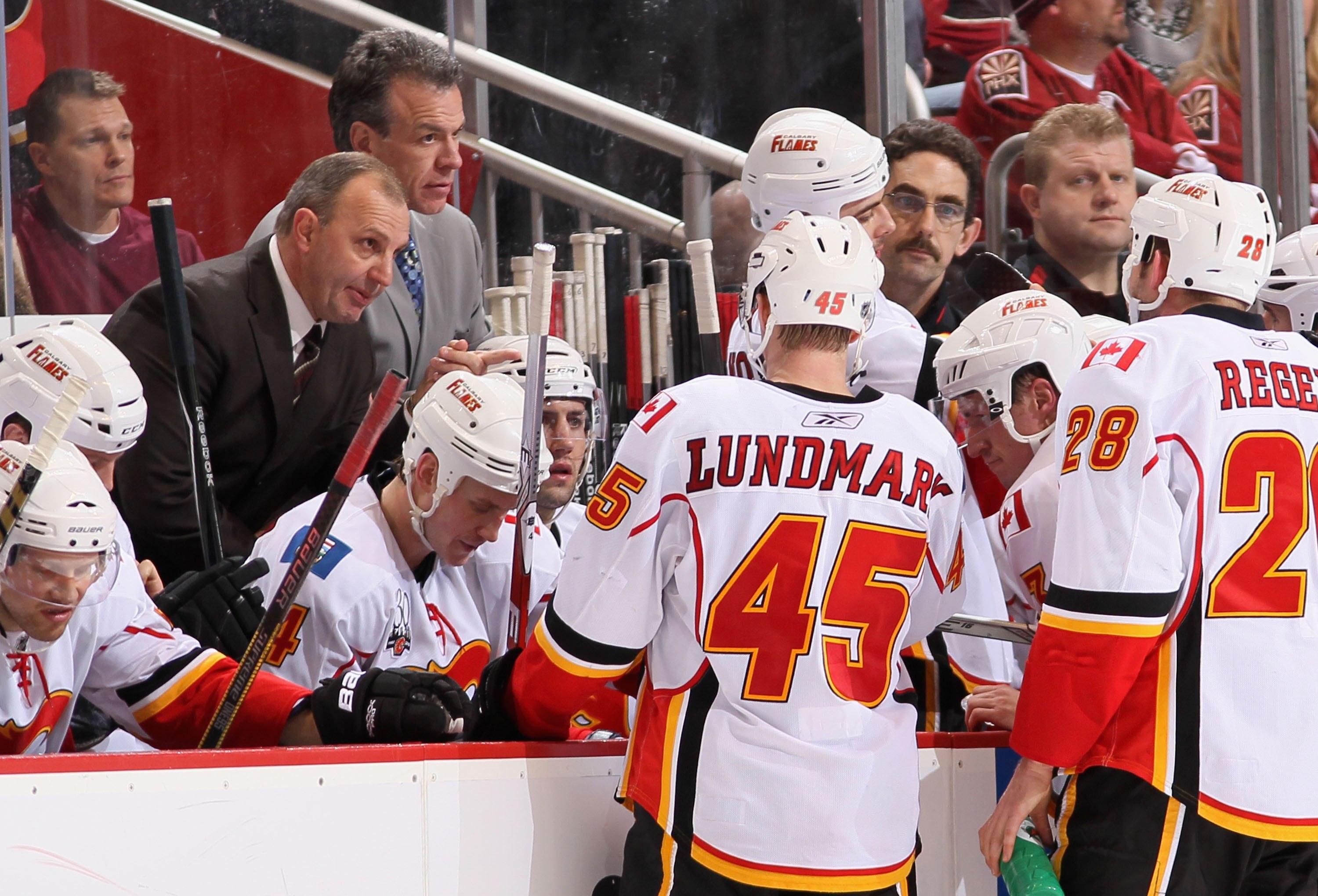 GLENDALE, AZ - JANUARY 28:  Head coach Brent Sutter of the Calgary Flames talks to his team during a time out in the NHL game against the Phoenix Coyotes at Jobing.com Arena on January 28, 2010 in Glendale, Arizona. The Coyotes defeated the Flames 3-2 in