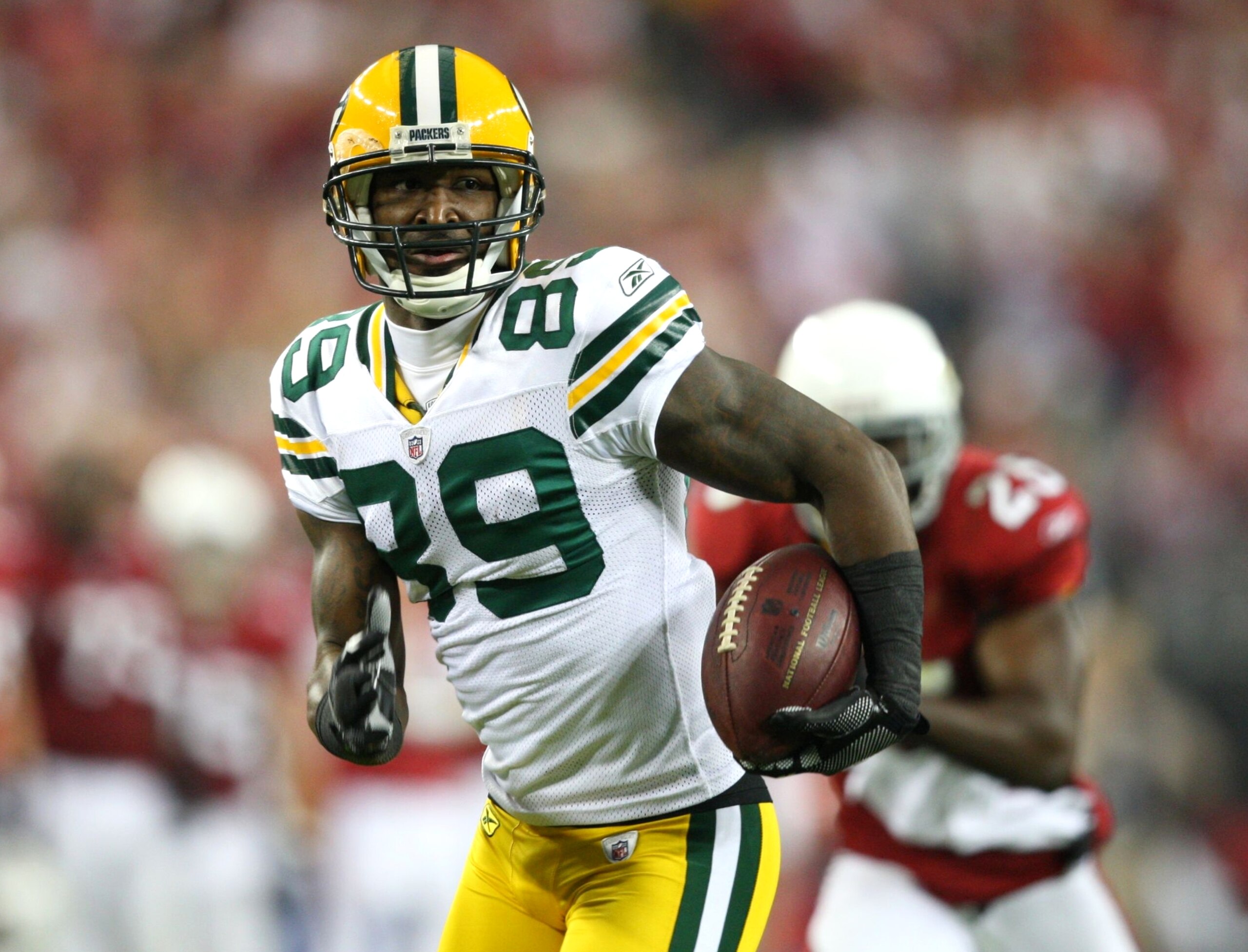 GLENDALE, AZ - JANUARY 10: James Jones #89 of the Green Bay Packers scores a touchdown against the Arizona Cardinals during the fourth quarter of the 2010 NFC wild-card playoff game at University of Phoenix Stadium on January 10, 2010 in Glendale, Arizon GLENDALE, AZ - JANUARY 10: James Jones #89 of the Green Bay Packers scores a touchdown against the Arizona Cardinals during the fourth quarter of the 2010 NFC wild-card playoff game at University of Phoenix Stadium on January 10, 2010 in Glendale, Arizon