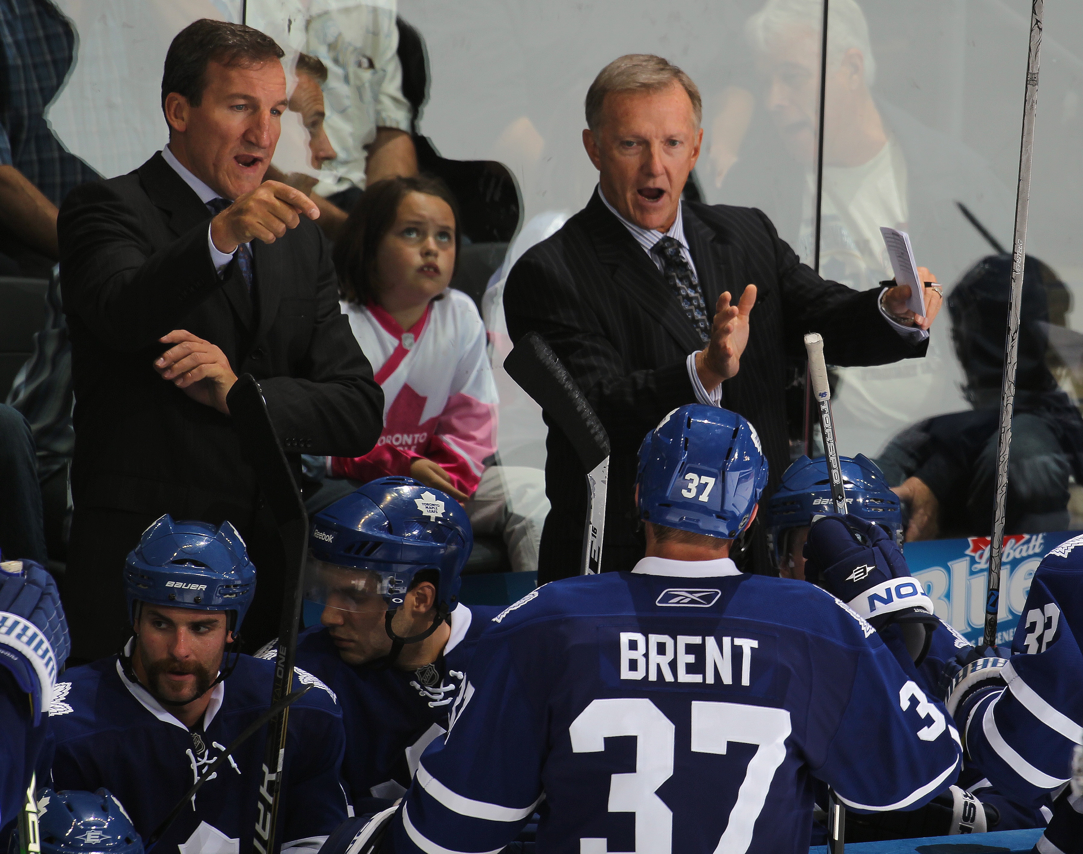 LONDON,ON - SEPTEMBER 23: Coaches Ron Wilson and Tim Hunter of the Toronto Maple Leafs give instruction prior to a shootout in a pre-season game against the Philadelphia Flyers on September 23,2010 at the John Labatt Centre in London, Ontario. The Leafs d