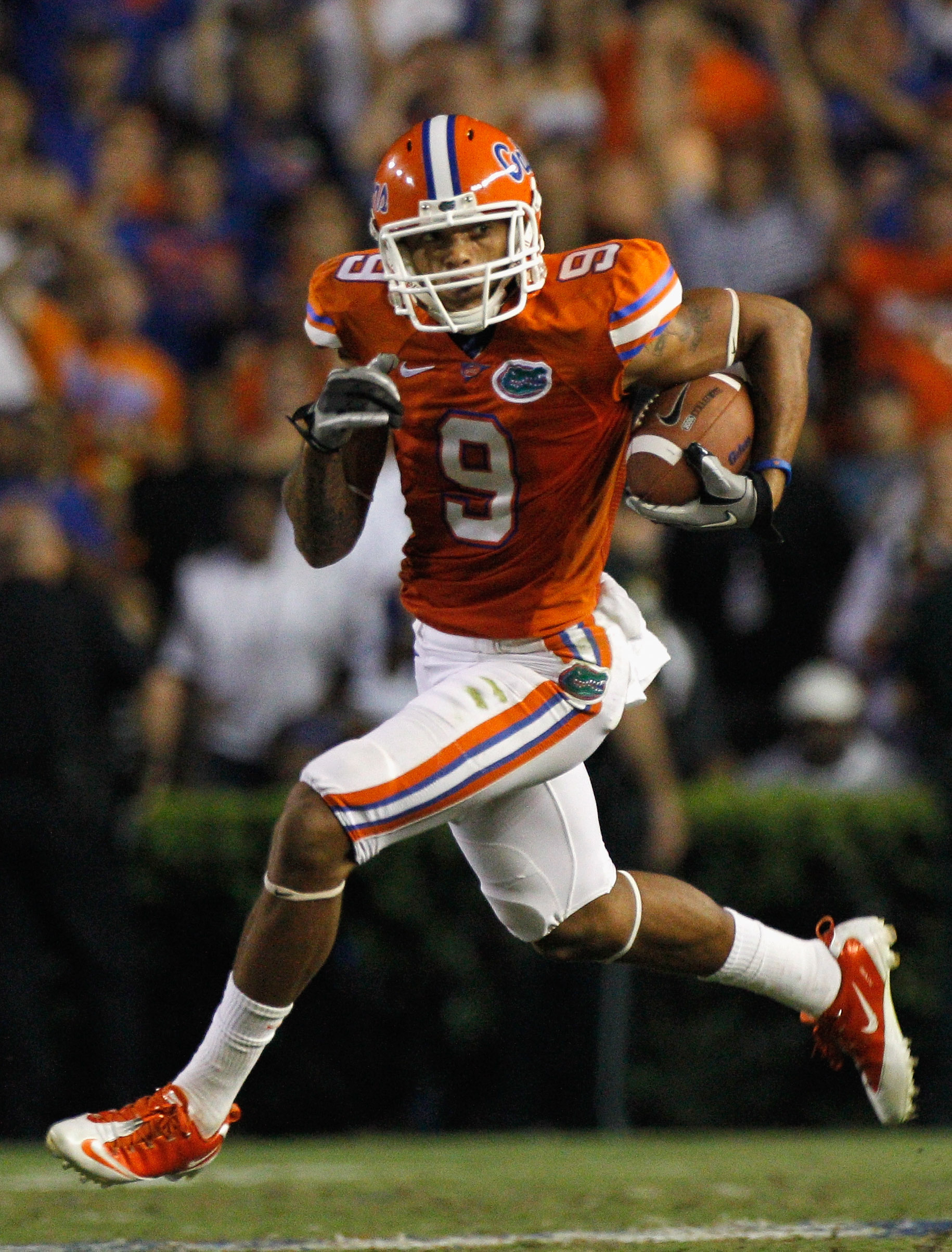 GAINESVILLE, FL - OCTOBER 09:  Carl Moore #9 of the Florida Gators runs for yardage during the game against the Louisiana State University Tigers at Ben Hill Griffin Stadium on October 9, 2010 in Gainesville, Florida.  (Photo by Sam Greenwood/Getty Images