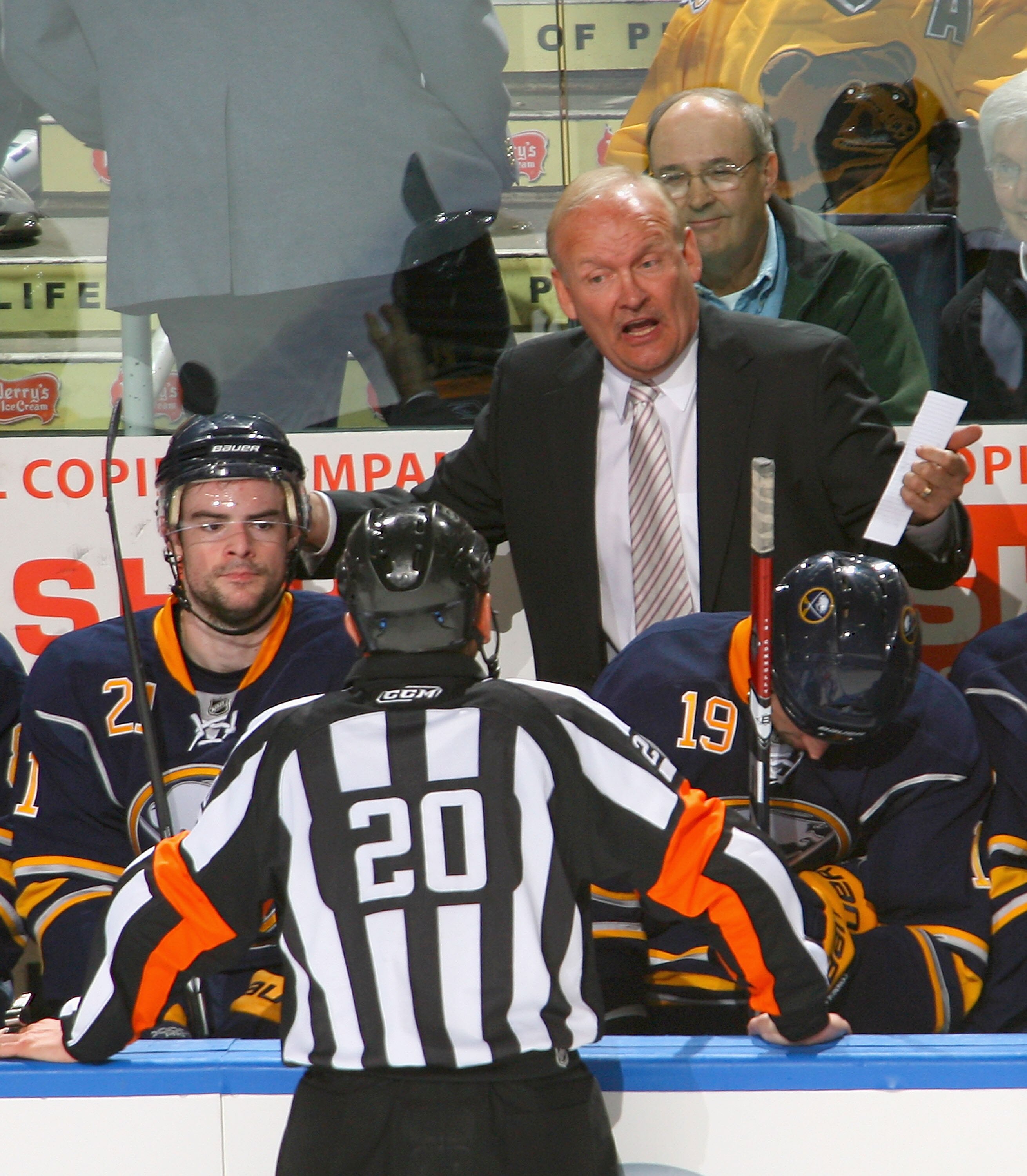 BUFFALO, NY - APRIL 23: Lindy Ruff , head coach of the Buffalo Sabres talks to referee Tim Peel #20 during a tim out against the Boston Bruins in Game Five of the Eastern Conference Quarterfinals during the 2010 NHL Stanley Cup Playoffs at HSBC Arena on A
