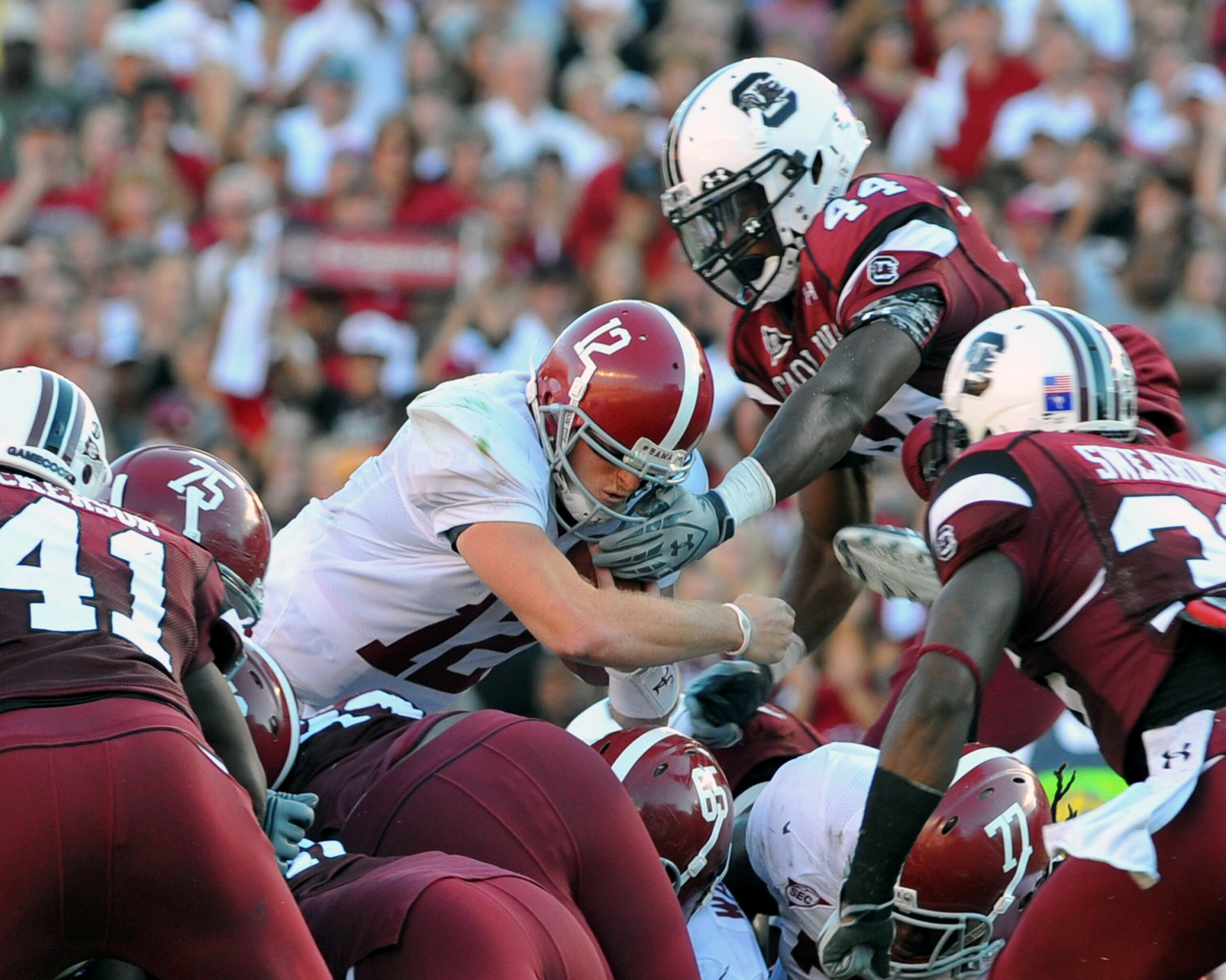 COLUMBIA, SC - OCTOBER 9: Quarterback Greg McElroy of the Alabama Crimson Tide dives for a short gain and a first down at midfield against the South Carolina Gamecocks October 9, 2010 at Williams-Brice Stadium in Columbia, South Carolina. (Photo by Al Me COLUMBIA, SC - OCTOBER 9: Quarterback Greg McElroy of the Alabama Crimson Tide dives for a short gain and a first down at midfield against the South Carolina Gamecocks October 9, 2010 at Williams-Brice Stadium in Columbia, South Carolina. (Photo by Al Me