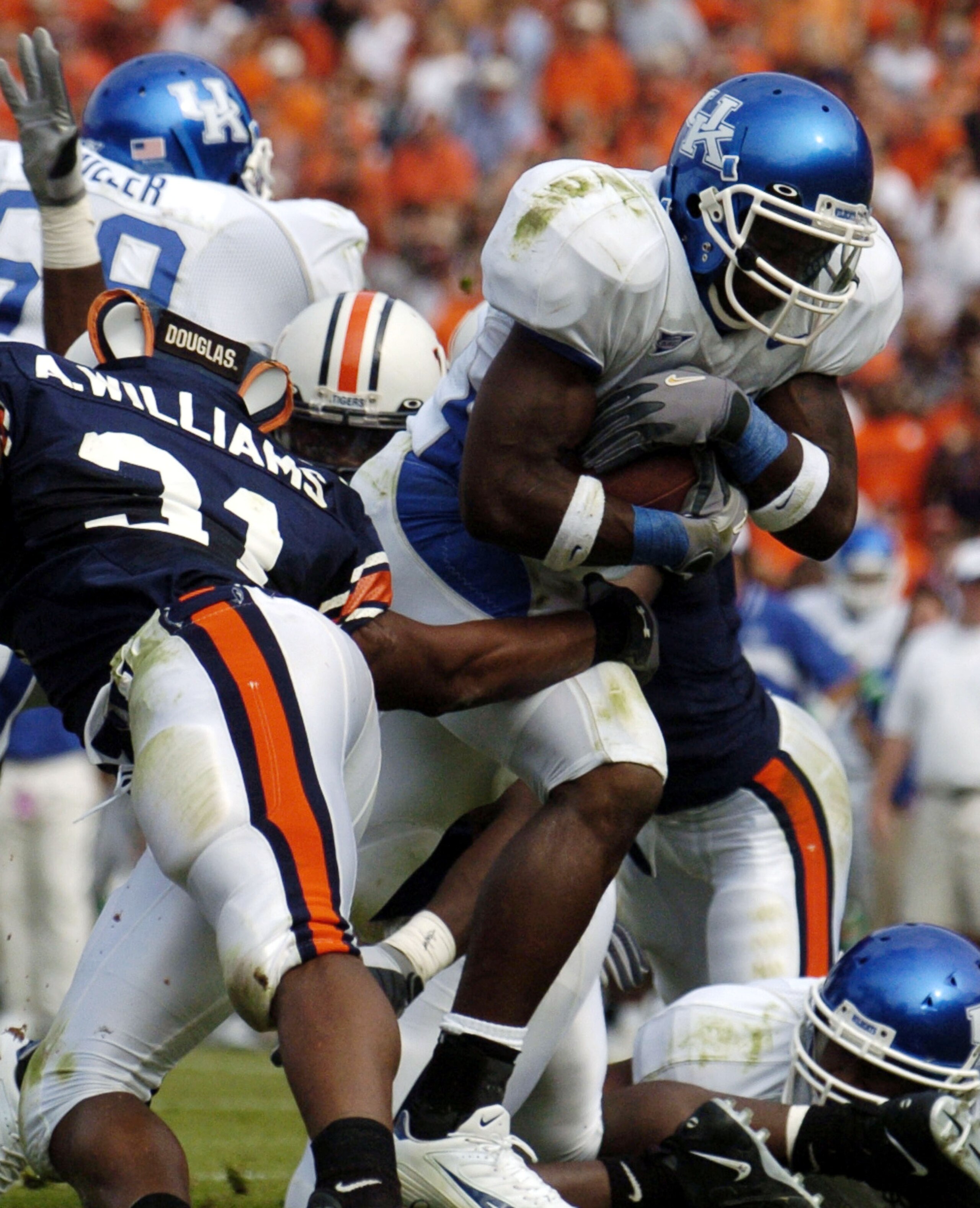 AUBURN, AL - OCTOBER 23: Rafael Little #22 of the Kentucky Wildcats scores a touchdown through the Auburn Tigers defense on October 23, 2004 at Jordan-Hare stadium in Auburn, Alabama. (Photo by Chris Graythen/Getty Images) AUBURN, AL - OCTOBER 23: Rafael Little #22 of the Kentucky Wildcats scores a touchdown through the Auburn Tigers defense on October 23, 2004 at Jordan-Hare stadium in Auburn, Alabama. (Photo by Chris Graythen/Getty Images)