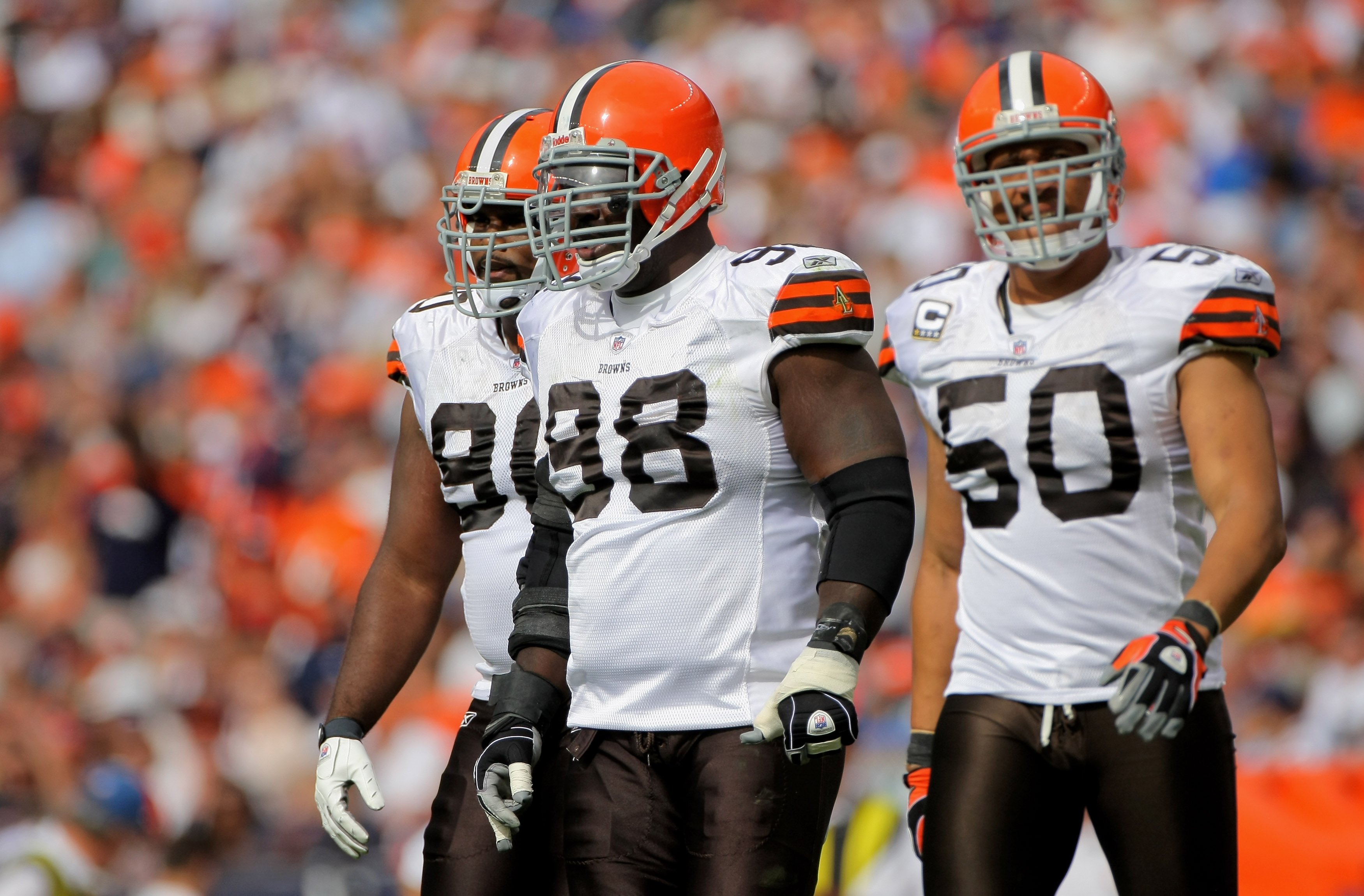 DENVER - SEPTEMBER 20:  Defensive players Kenyon Coleman #90, Robarie Smith #98 and Eric Barton #50 of the Cleveland Browns take the field against the Denver Broncos during NFL action at Invesco Field at Mile High on September 20, 2009 in Denver, Colorado