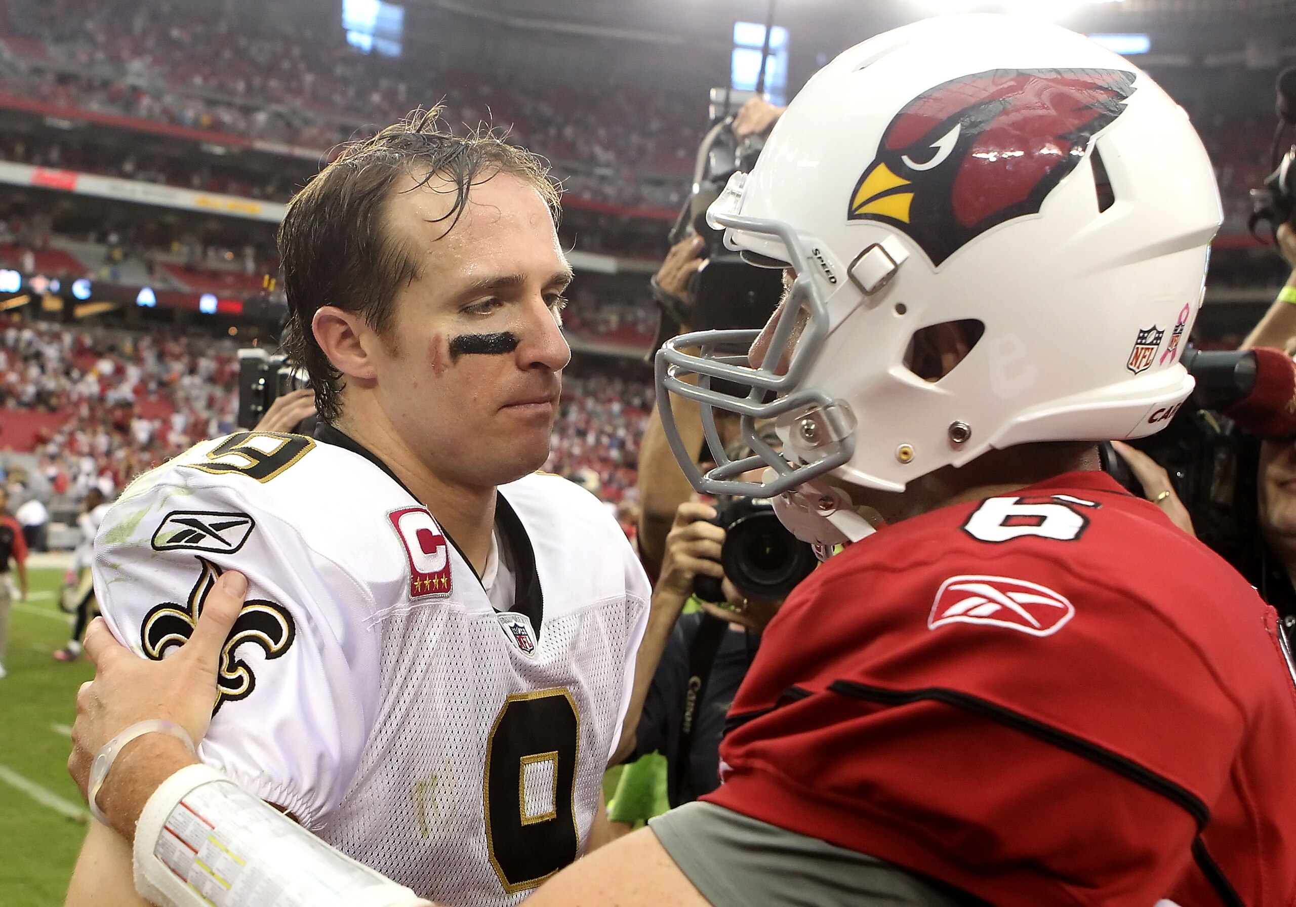 GLENDALE, AZ - OCTOBER 10:  Quarterbacks Drew Brees #9 of the New Orleans Saints and Max Hall #6 of the Arizona Cardinals talk following the NFL game at the University of Phoenix Stadium on October 10, 2010 in Glendale, Arizona. The Cardinals defeated the