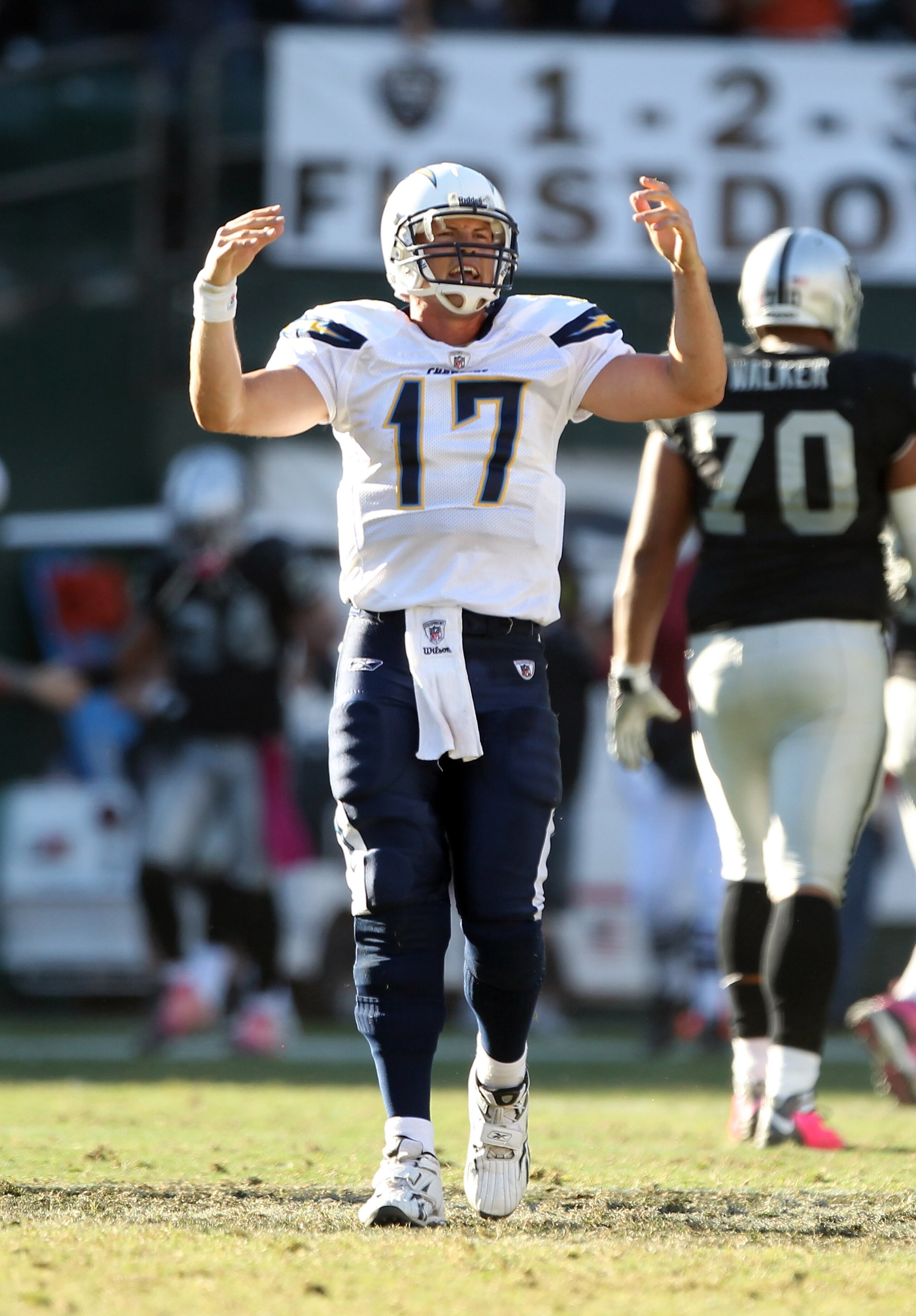 OAKLAND, CA - OCTOBER 10: Philip Rivers #17 of the San Diego Chargers reacts after Tyvon Branch #33 of the Oakland Raiders picked up a fumble and returned it for a touchdwon in the fourth quarter of their game at Oakland-Alameda County Coliseum on October