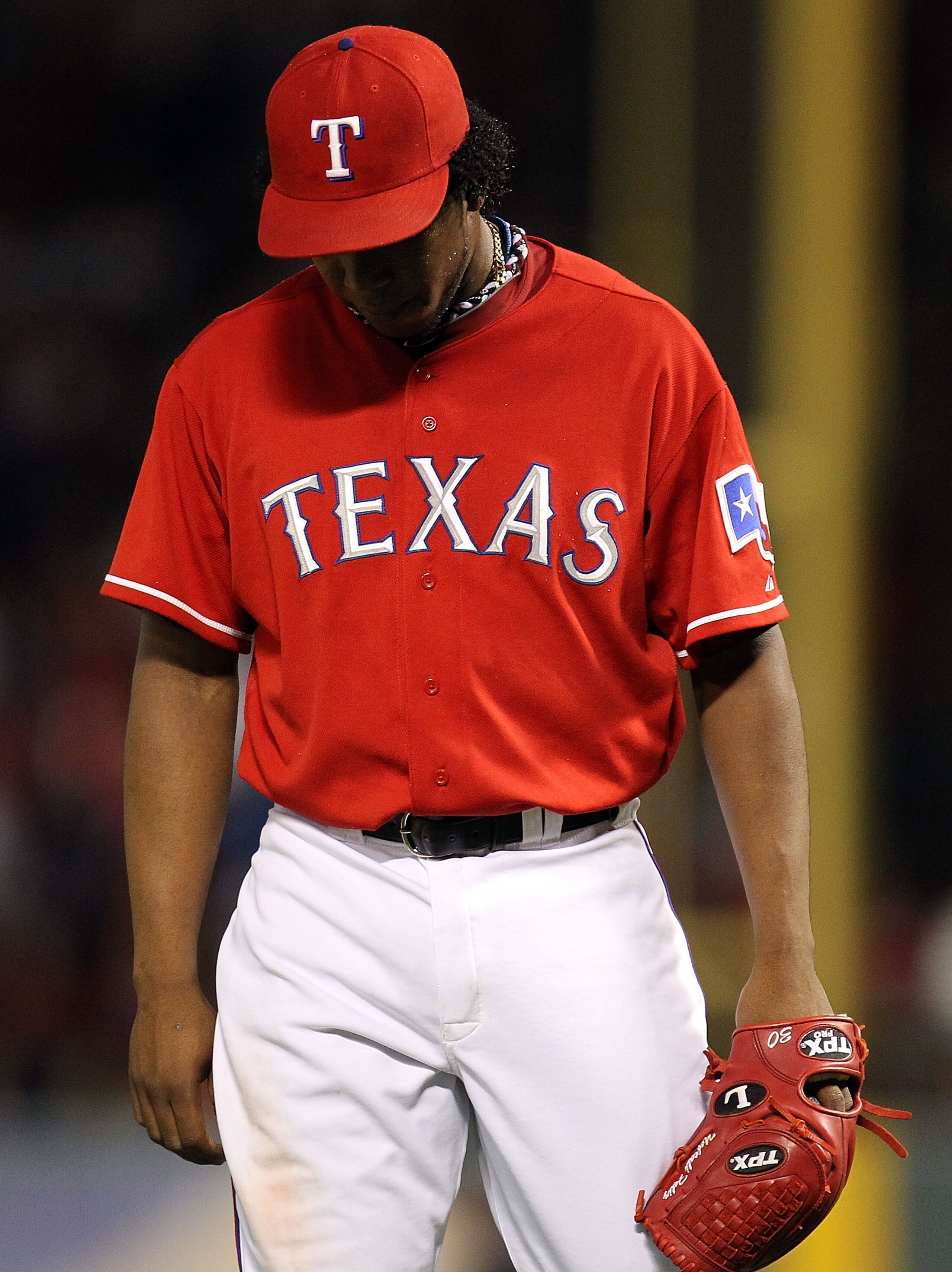ARLINGTON, TX - OCTOBER 09:  Pitcher Neftali Feliz #30 of the Texas Rangers reacts after giving up a homerun to Carl Crawford #13 of the Tampa Bay Rays in the 9th inning during game 3 of the ALDS at Rangers Ballpark in Arlington on October 9, 2010 in Arli