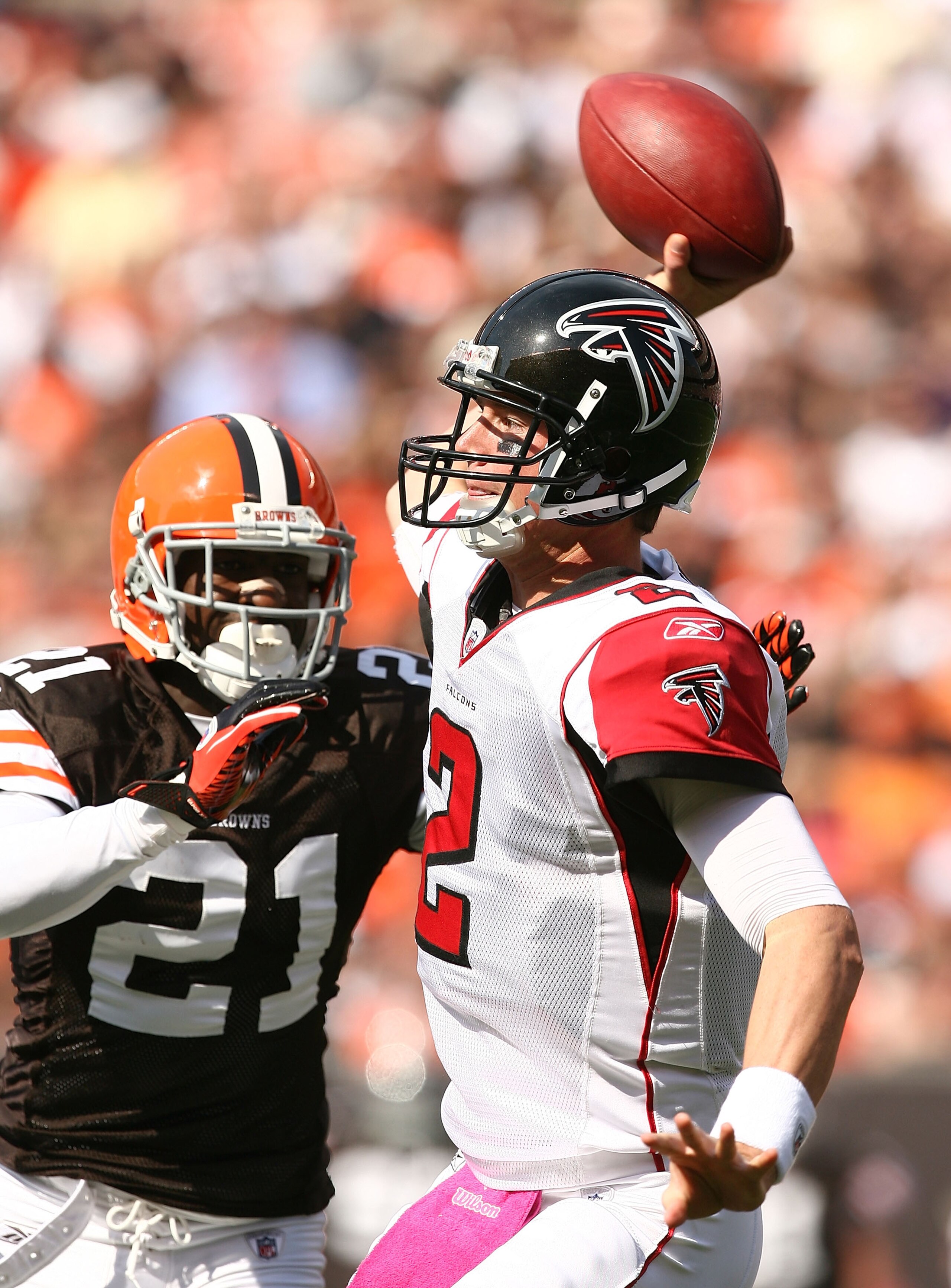CLEVELAND - OCTOBER 10:  Quarterback Matt Ryan #2 of the Atlanta Falcons throws to a receiver as he is pressured by defensive back Eric Wright #21 at Cleveland Browns Stadium on October 10, 2010 in Cleveland, Ohio.  (Photo by Matt Sullivan/Getty Images)