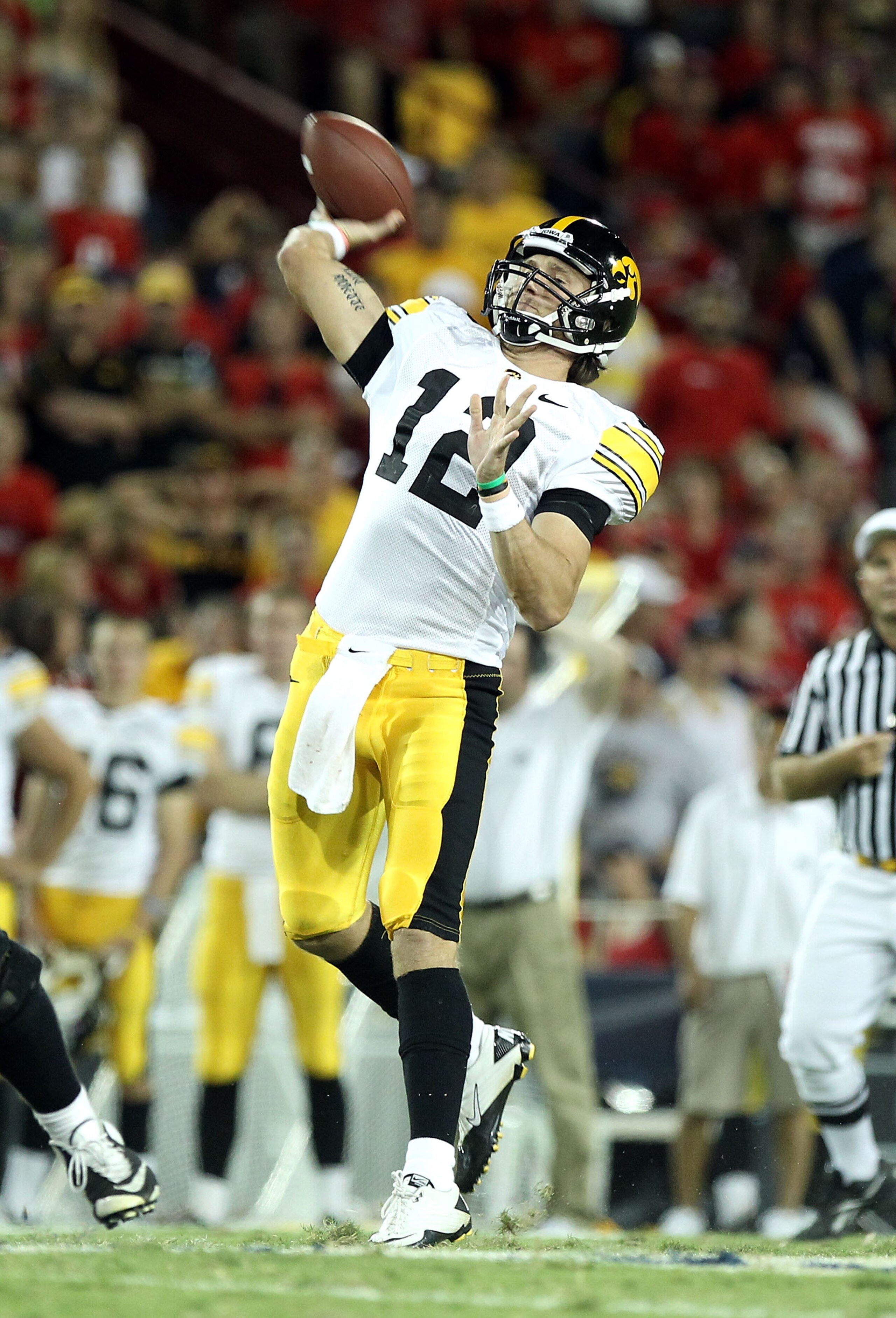 TUCSON, AZ - SEPTEMBER 18:  Quarterback Ricky Stanzi #12 of the Iowa Hawkeyes throws a pass during the college football game against the Arizona Wildcats at Arizona Stadium on September 18, 2010 in Tucson, Arizona.  The Wildcats defeated the Hawkeyes 34-2