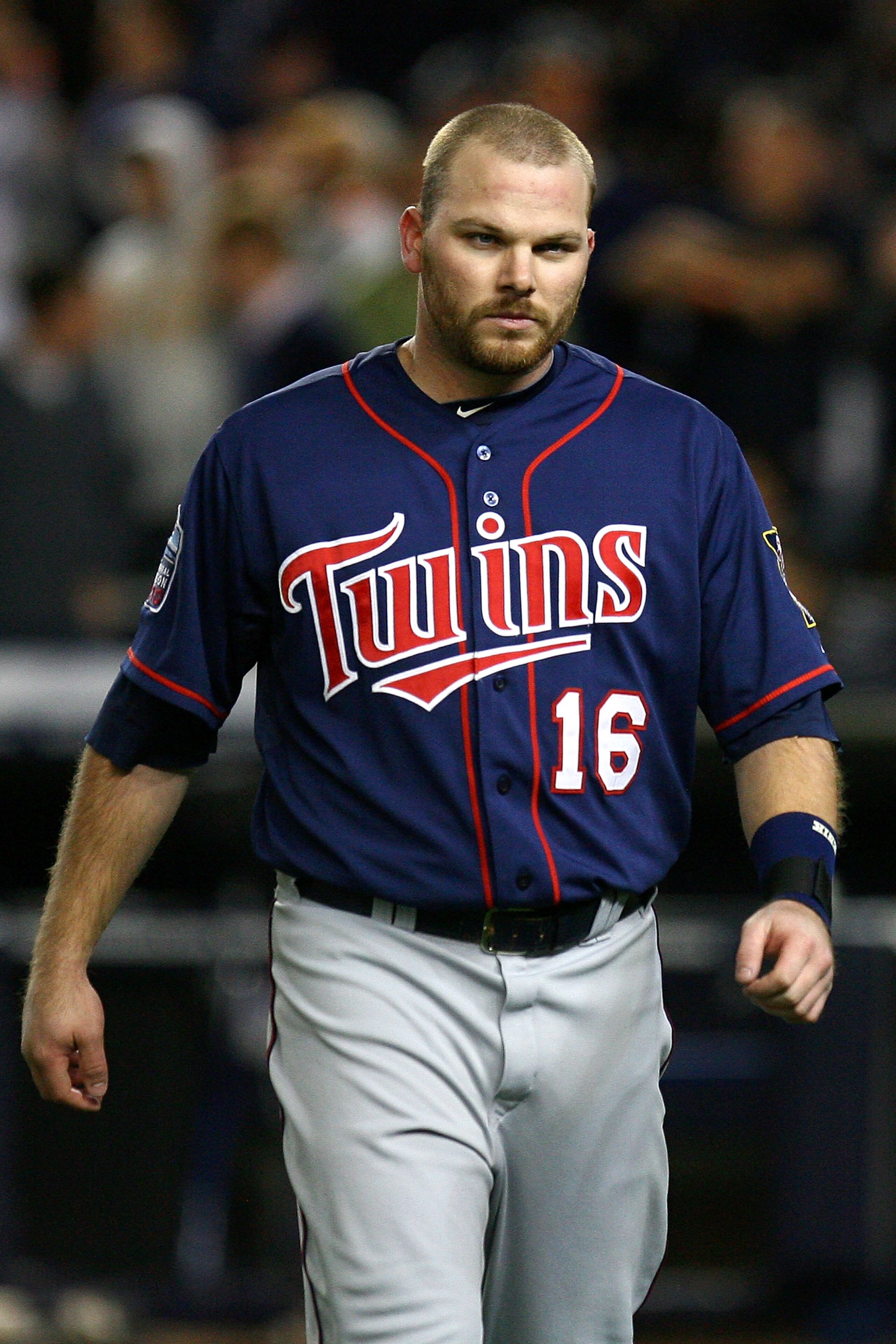 NEW YORK - OCTOBER 09:  Jason Kubel #16 of the Minnesota Twins reacts as he walsk back to the dugout after he struck out in the top of the sixth inning against the New York Yankees  during Game Three of the ALDS part of the 2010 MLB Playoffs at Yankee Sta