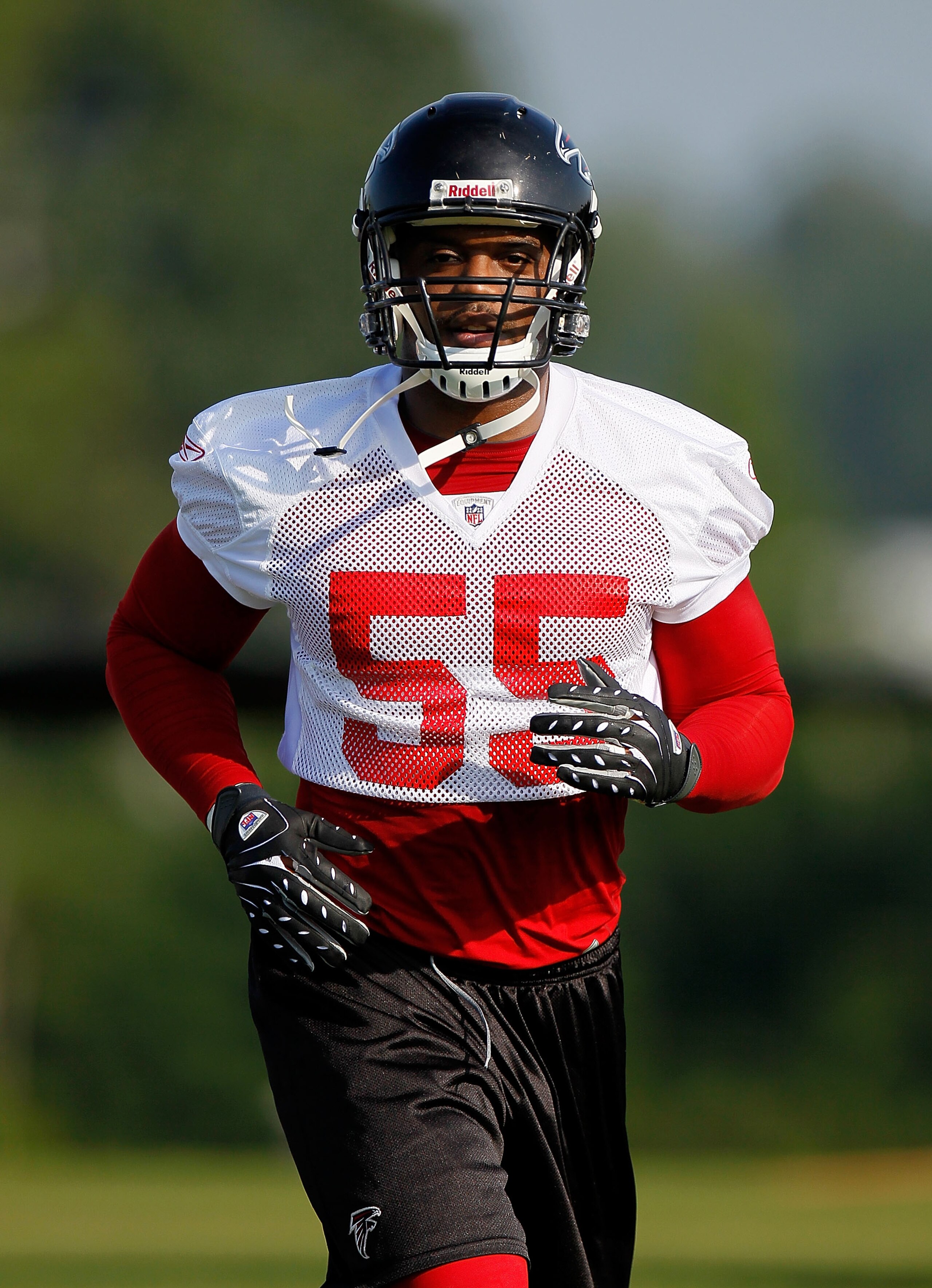 FLOWERY BRANCH, GA - JULY 30:  John Abraham #55 of the Atlanta Falcons runs drills during opening day of training camp on July 30, 2010 at the Falcons Training Complex in Flowery Branch, Georgia.  (Photo by Kevin C. Cox/Getty Images)