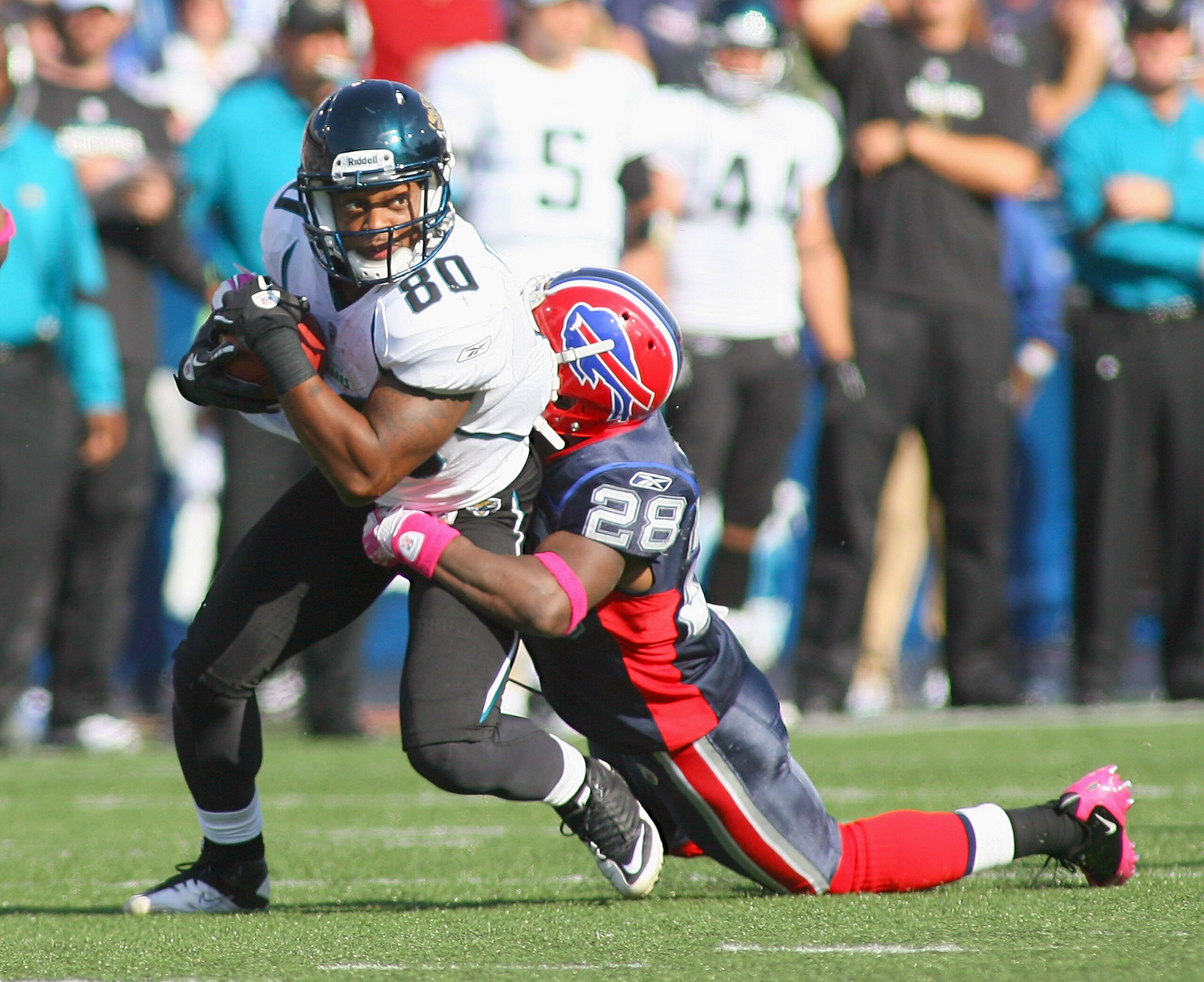 ORCHARD PARK, NY - OCTOBER 10: Mike Thomas #80 of the Jacksonville Jaguars is tackled by Leodis McKelvin #28 of the Buffalo Bills  at Ralph Wilson Stadium on October 10, 2010 in Orchard Park, New York. Jacksonville won 36-26. (Photo by Rick Stewart/Getty 
