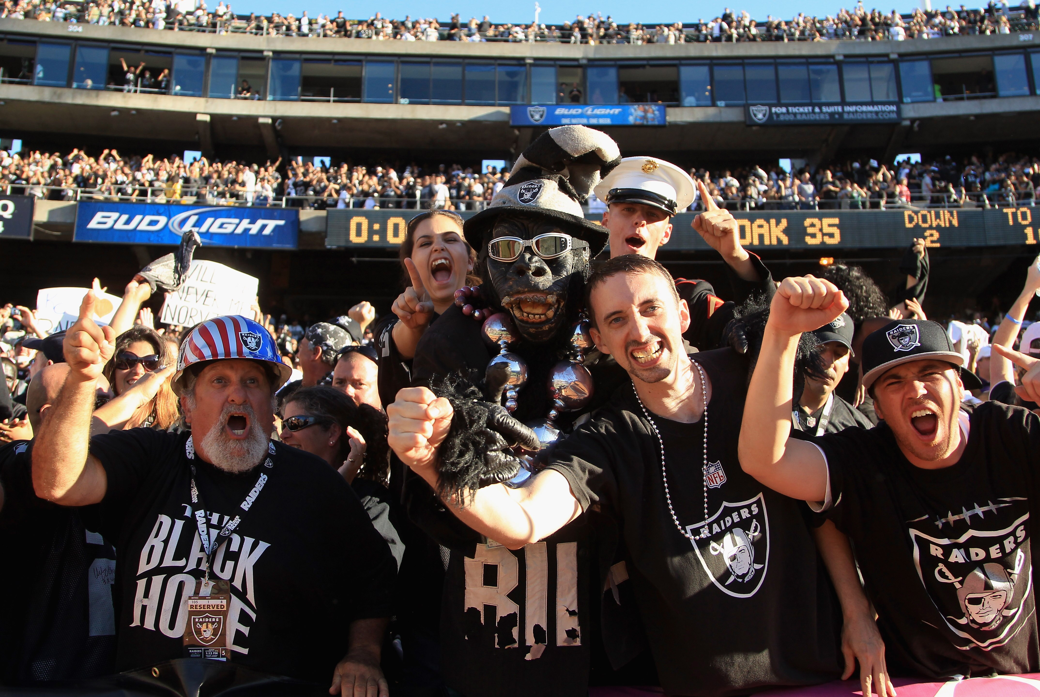 OAKLAND, CA - OCTOBER 10:  Oakland Raiders fans celebrate after they beat the San Diego Chargers at Oakland-Alameda County Coliseum on October 10, 2010 in Oakland, California.  (Photo by Ezra Shaw/Getty Images)