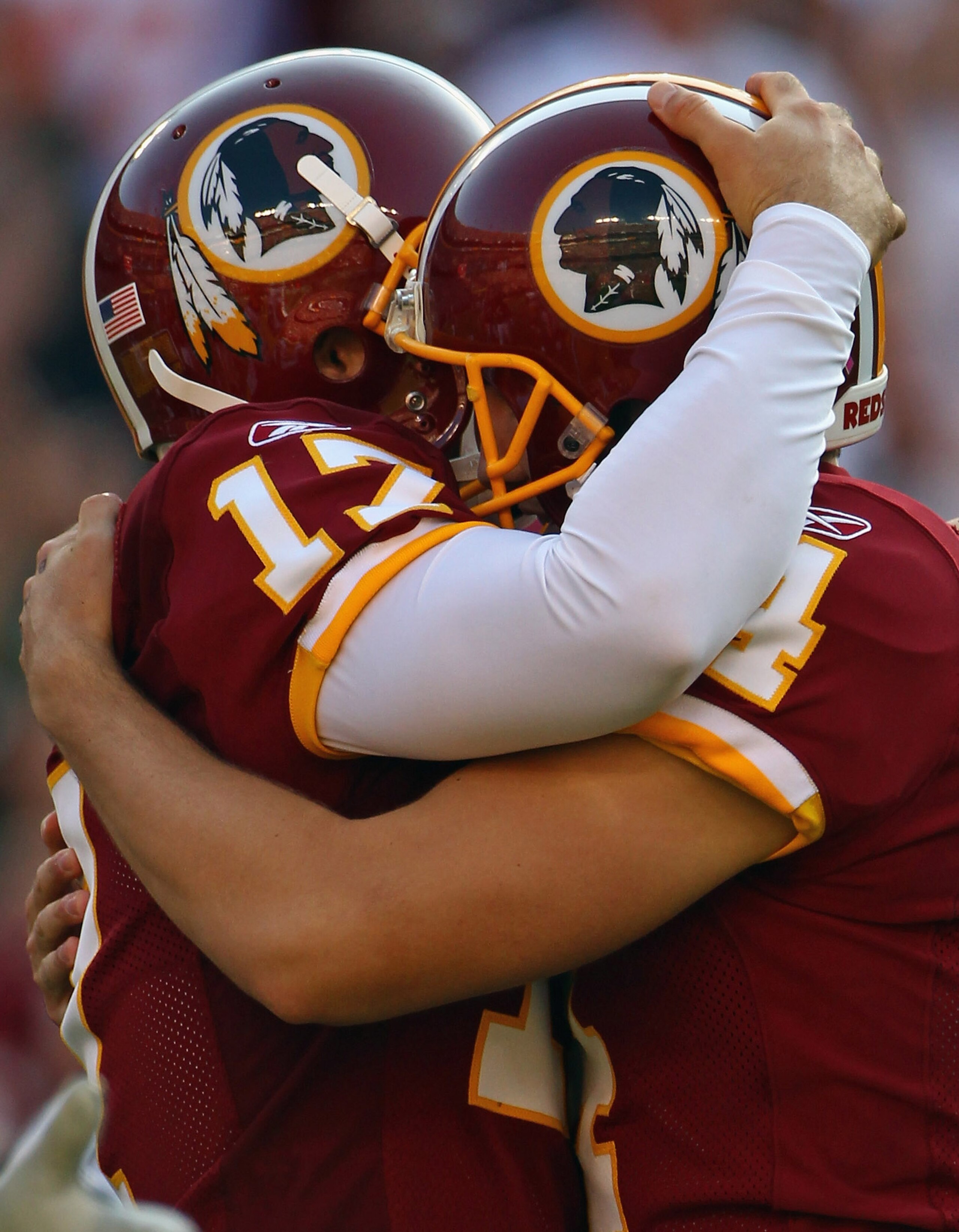 LANDOVER, MD - OCTOBER 10: Washington Redskins kicker Graham Gano #4 is hugged by punter Hunter Smith #17 after kicking the game winning kick in overtime against the Green Bay Packers at FedExField on October 10, 2010 in Landover, Maryland. The Redskins w